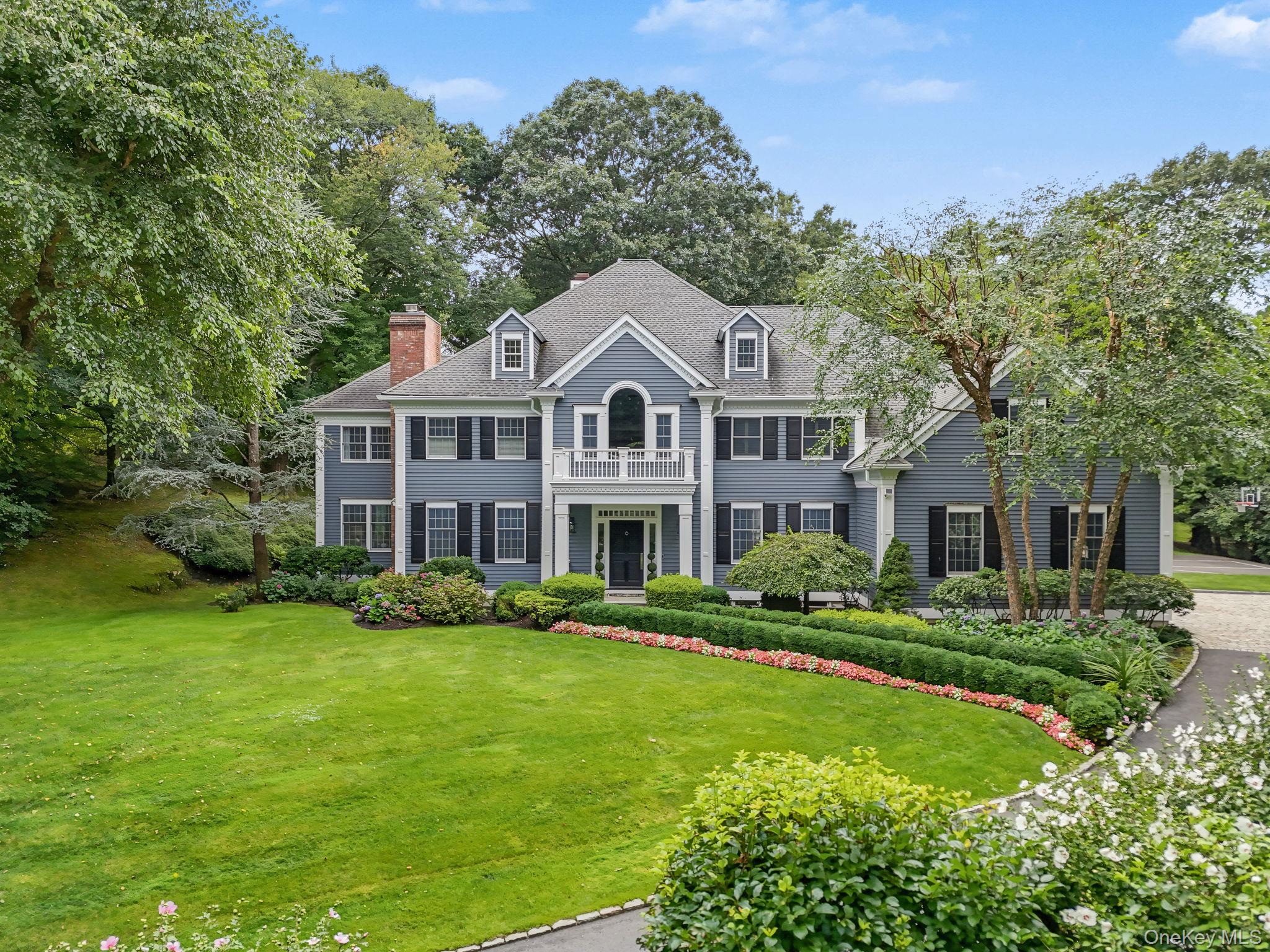 A long, majestic, illuminated tree-lined driveway introduces this soph...