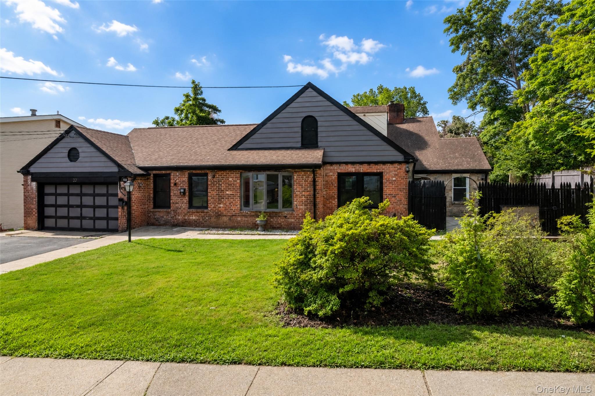 Discover a truly one-of-a-kind brick-and-stone Cape Cod home offering...