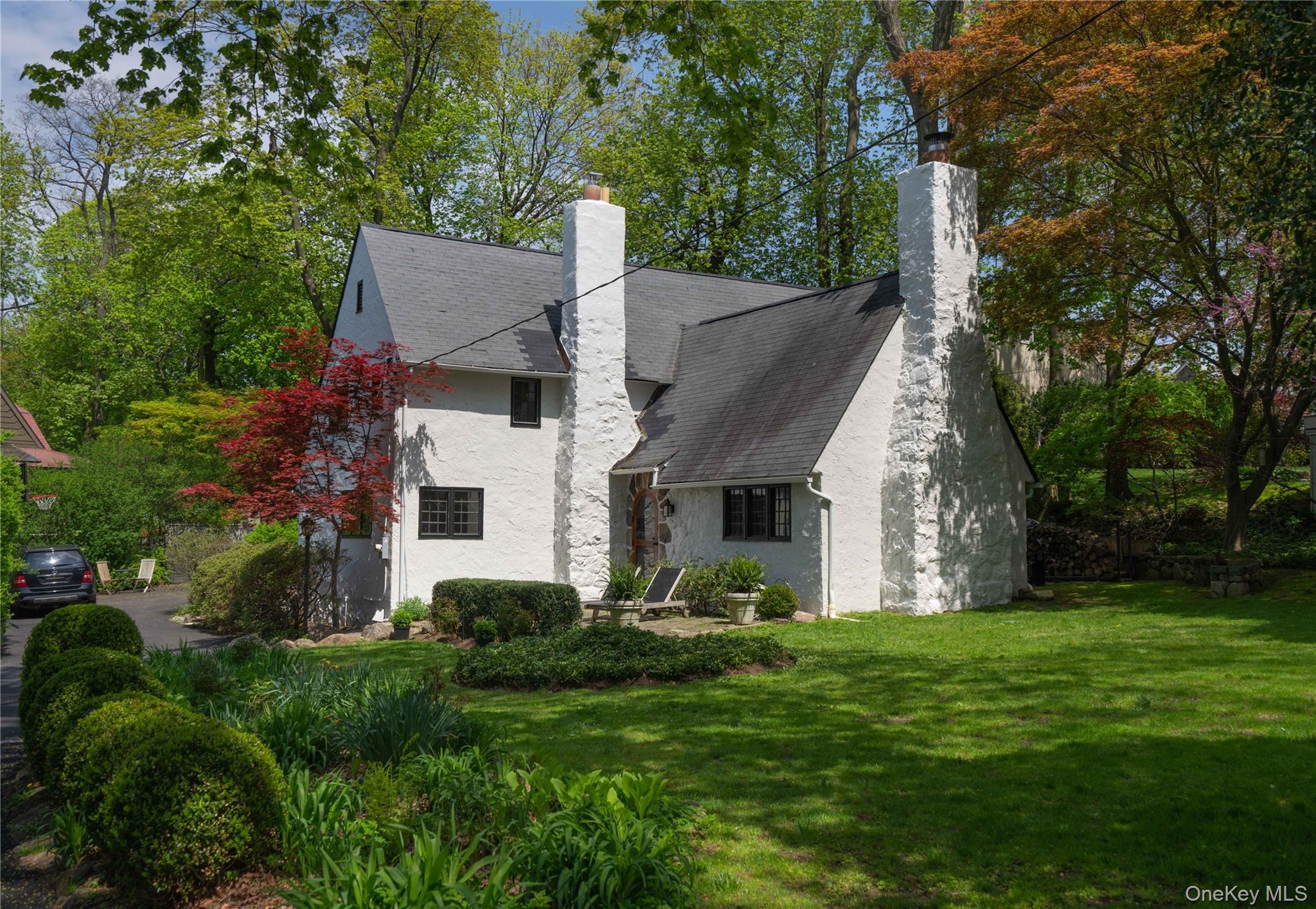 Step into this enchanting storybook Tudor, where timeless architecture...