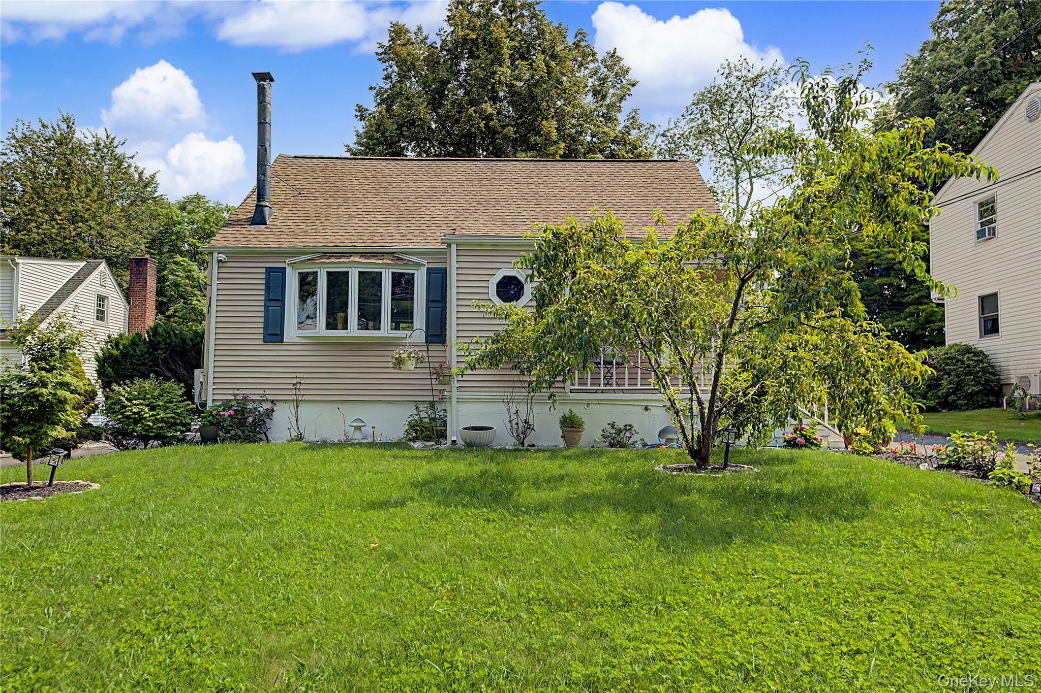 Welcome to this beautifully updated Cape Cod at 12 Saratoga Road, offe...