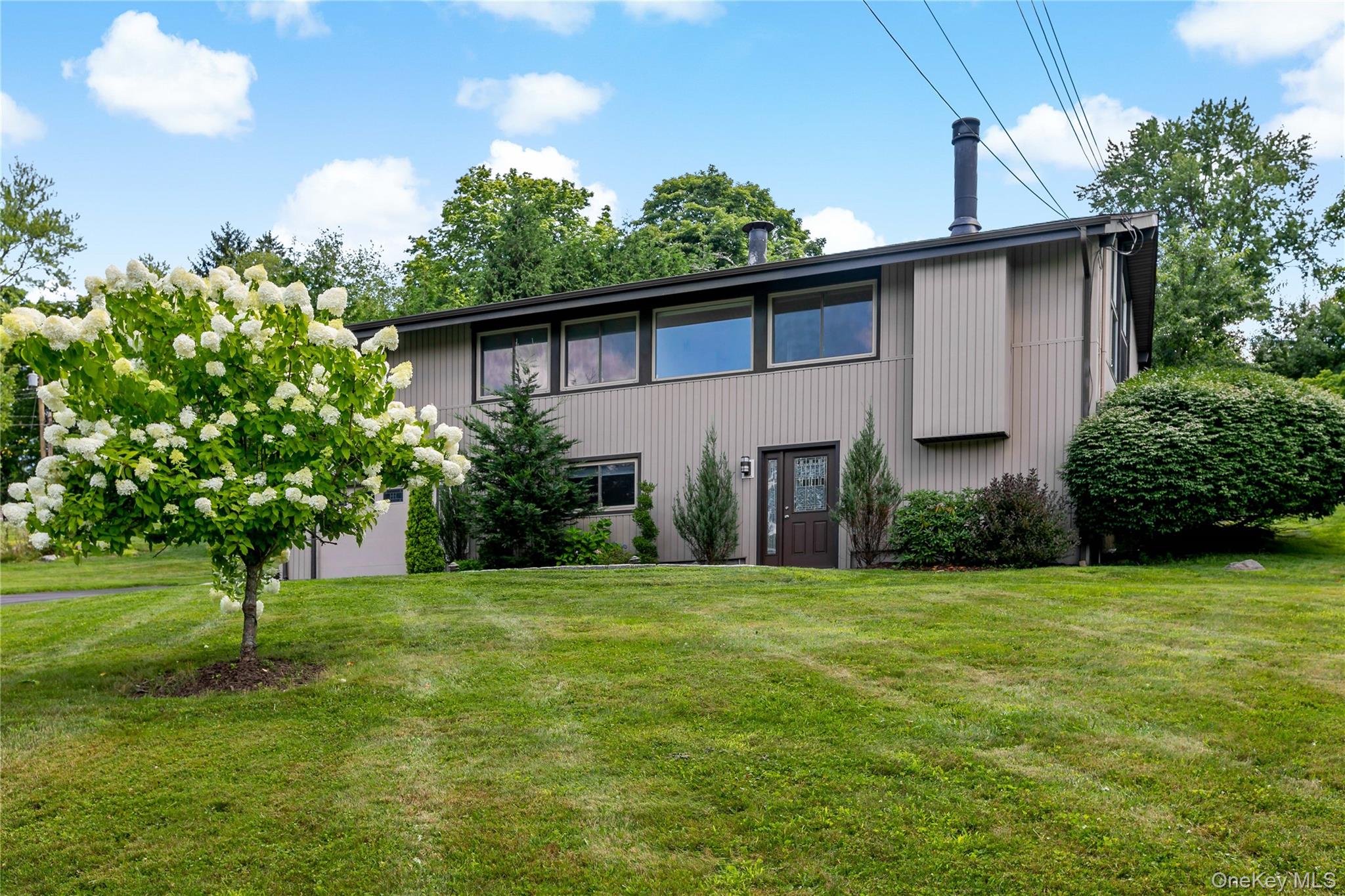 Move right into this spacious, sun-filled contemporary featuring an op...