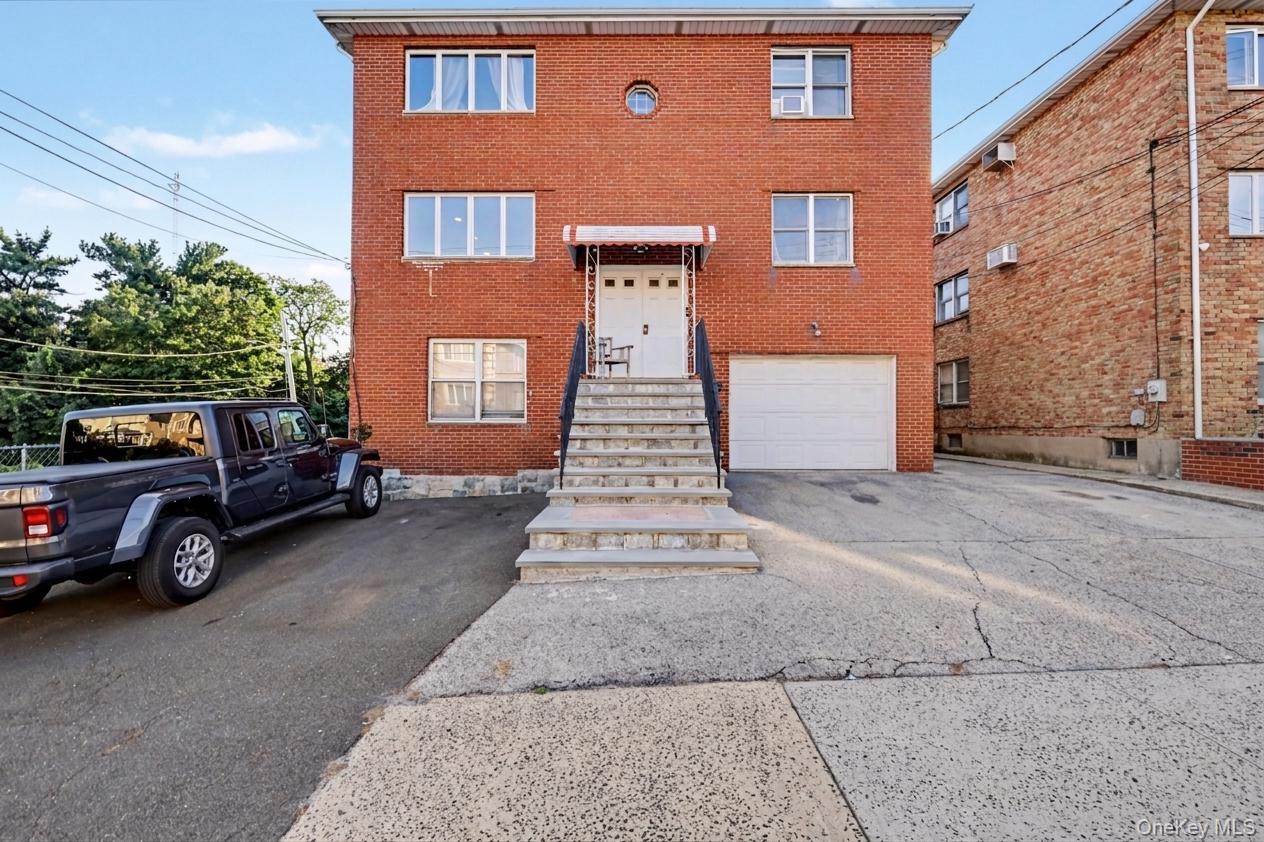 Discover the allure of this well maintained, all-brick two-family home...