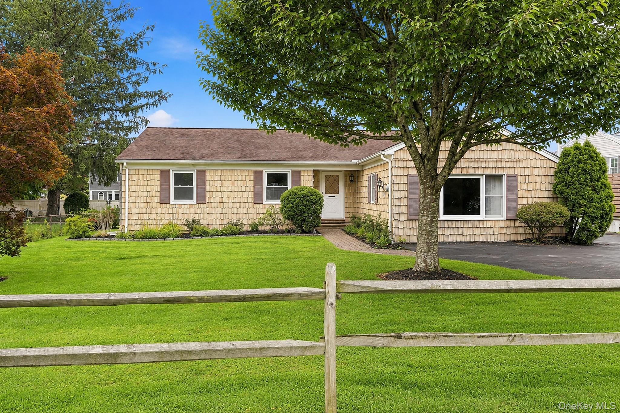Classic charm meets easy modern living in this Shaker-style ranch tuck...