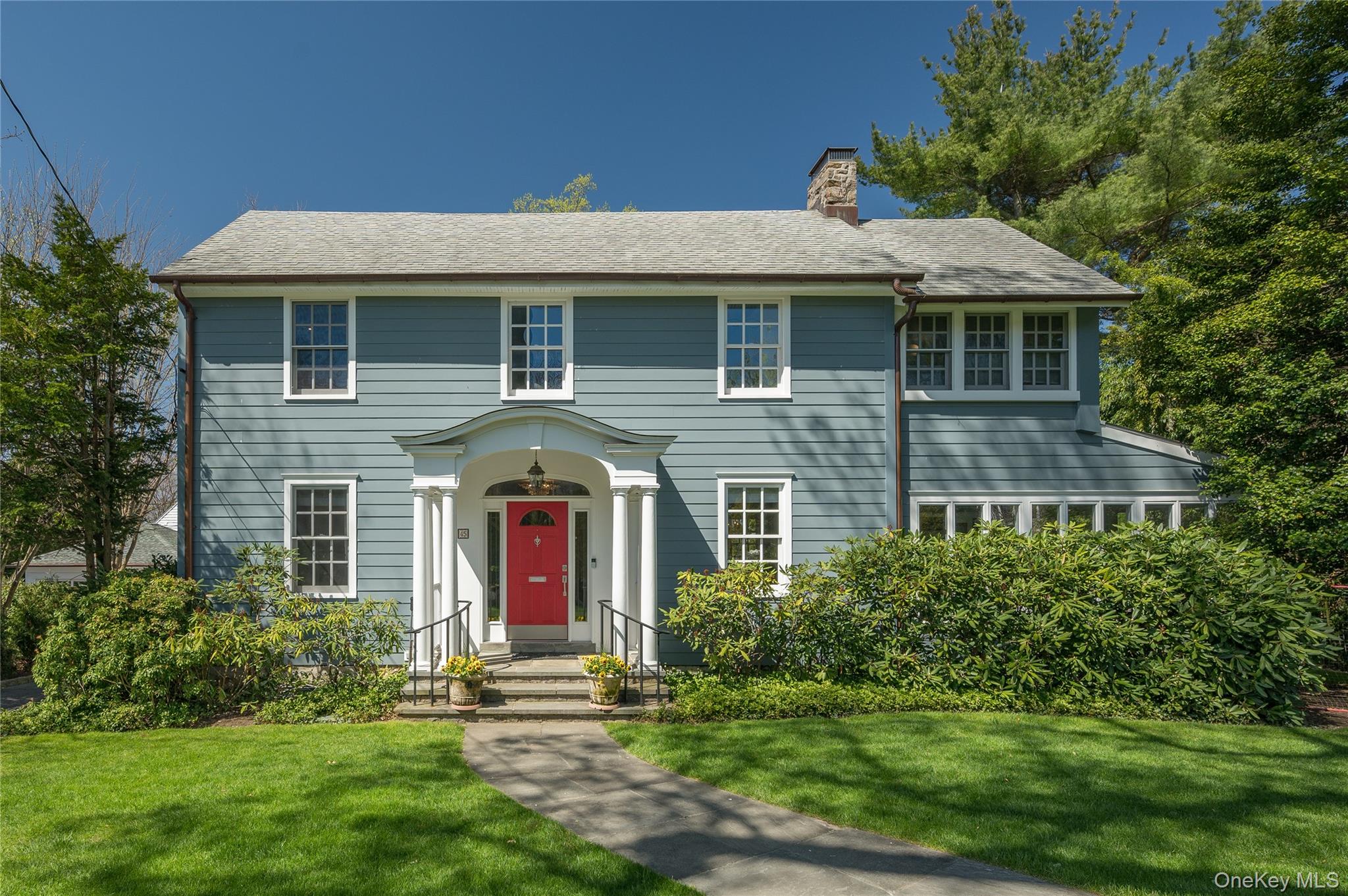 This stunningly updated center hall Colonial sits on one of Bronxville...