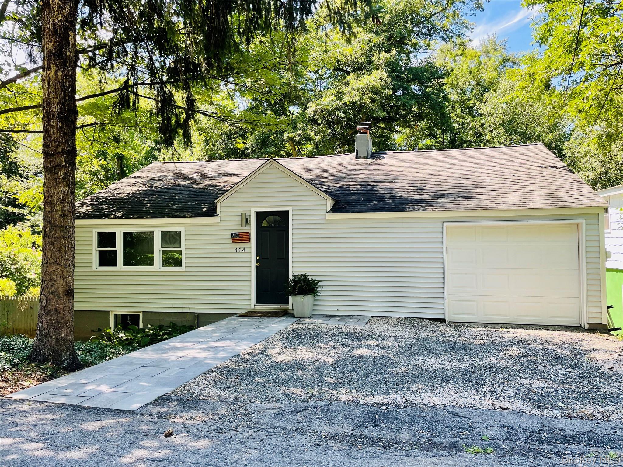 Enjoy peaceful lake area living in this charming reverse living home,...