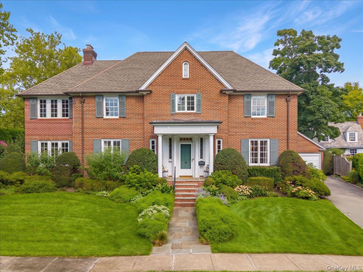 Situated on a private corner property framed by beautifully designed g...