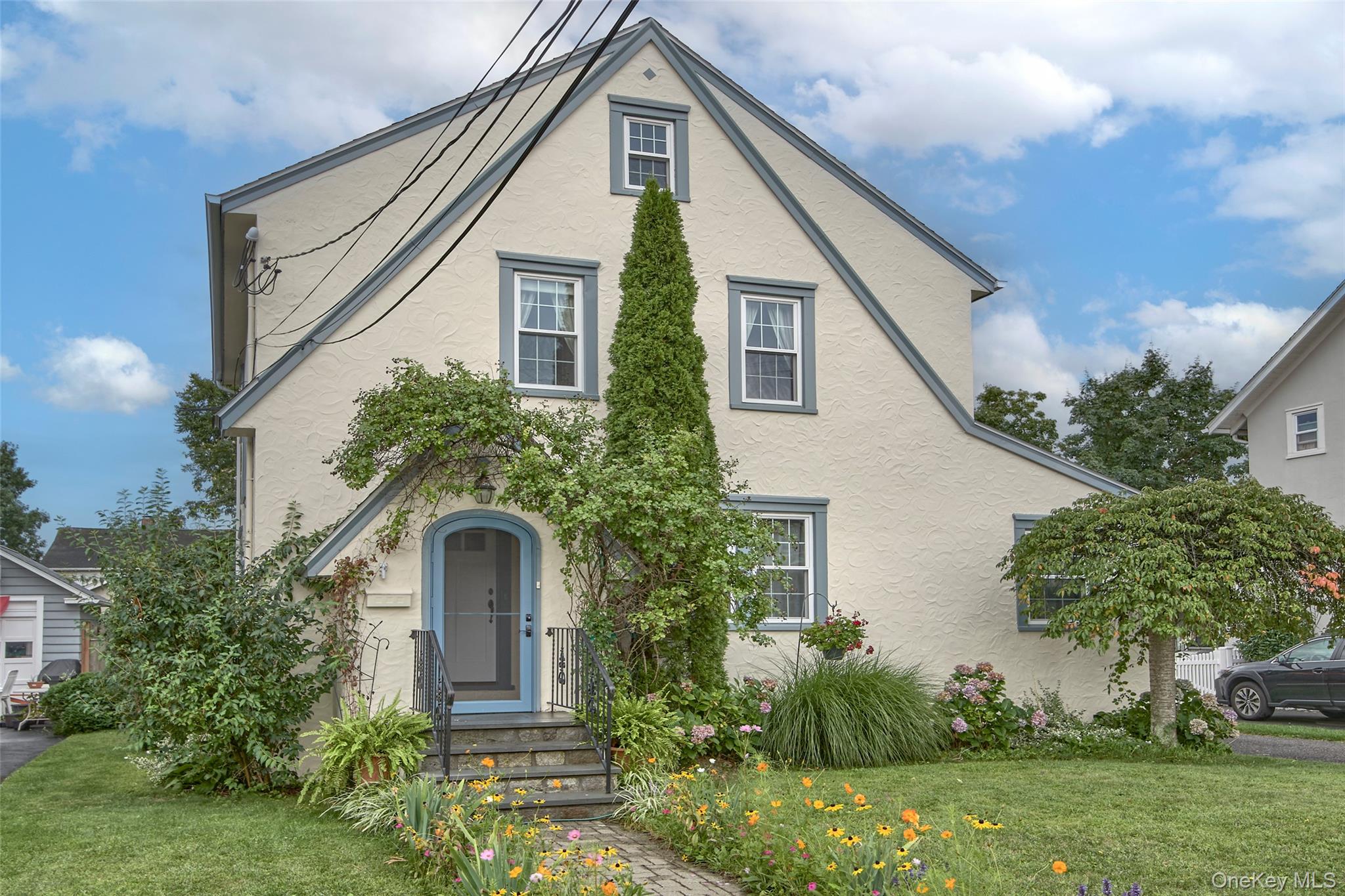 Welcome Home! This charming 1930s Tudor is perfectly situated on a des...