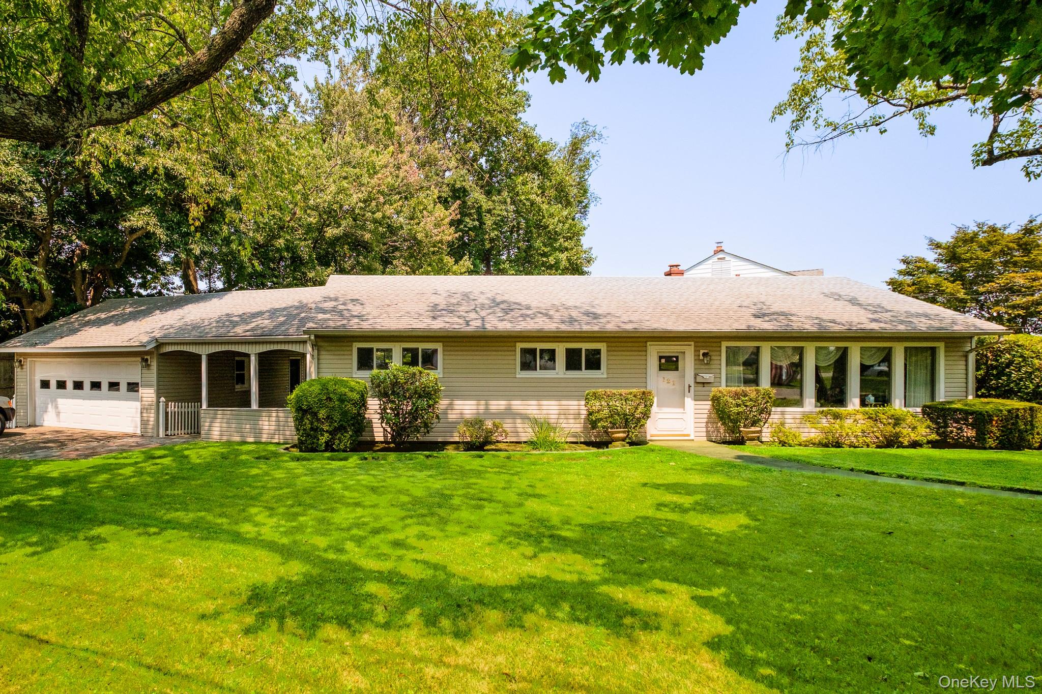 Welcome to this well-maintained and lovingly cared-for corner property...