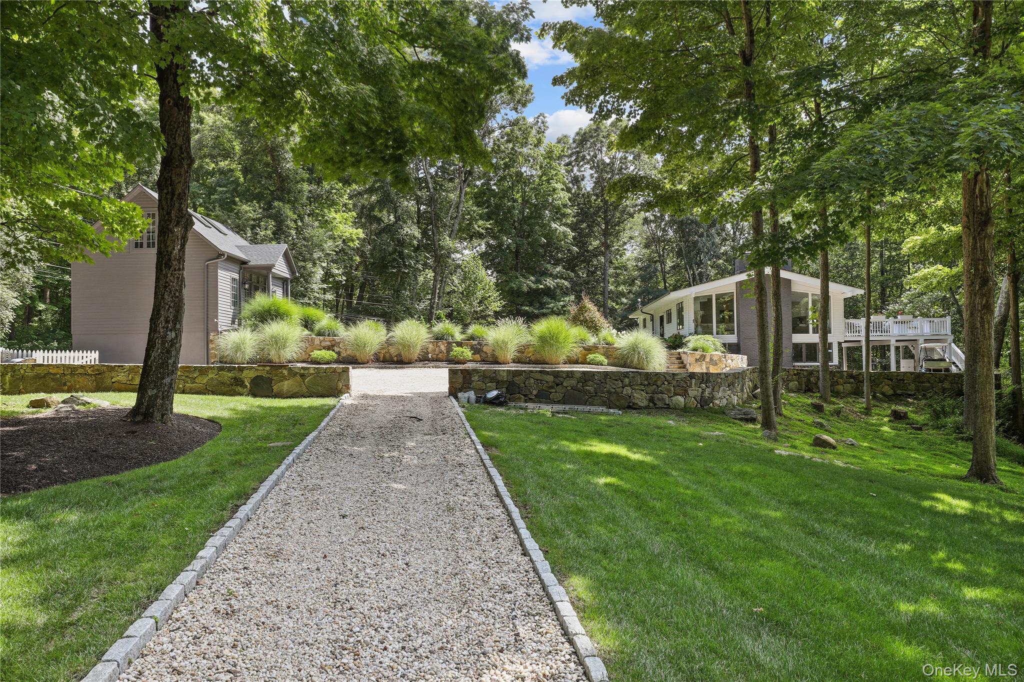 Set behind private gates on bucolic, quiet property, this fully renova...