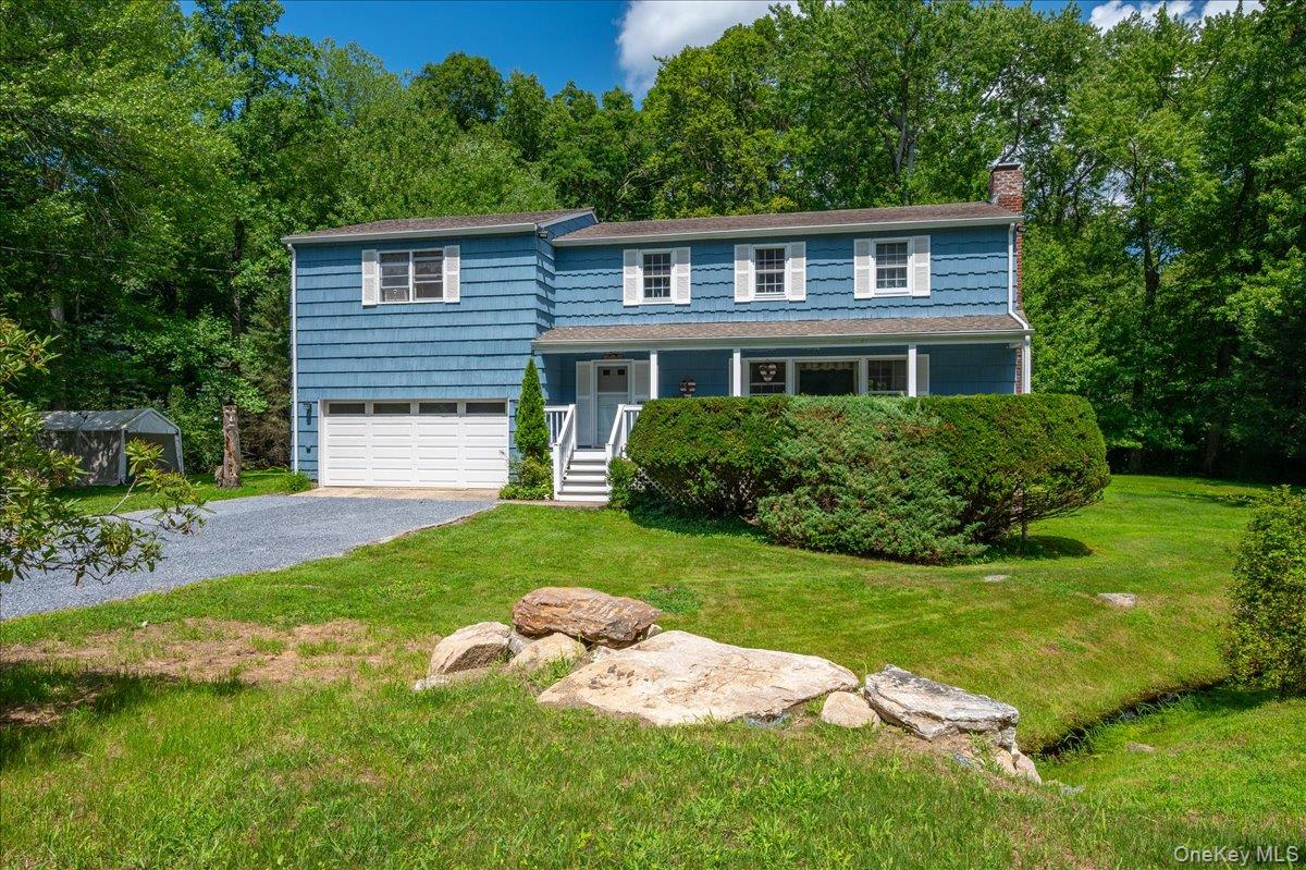 Welcome to 9 Laurel Road, a spacious home set on 1.5 acres along a qui...