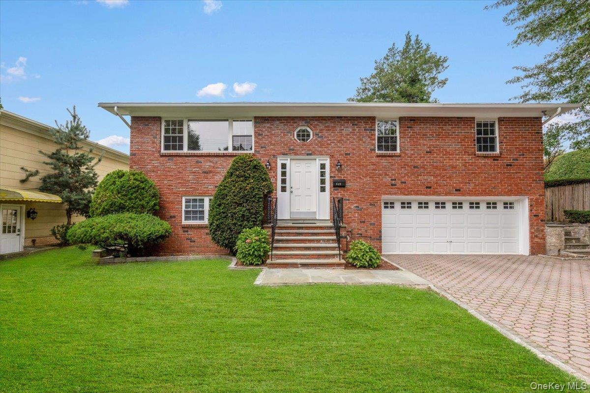 Welcome to this beautifully presented brick split-level home, ideally...