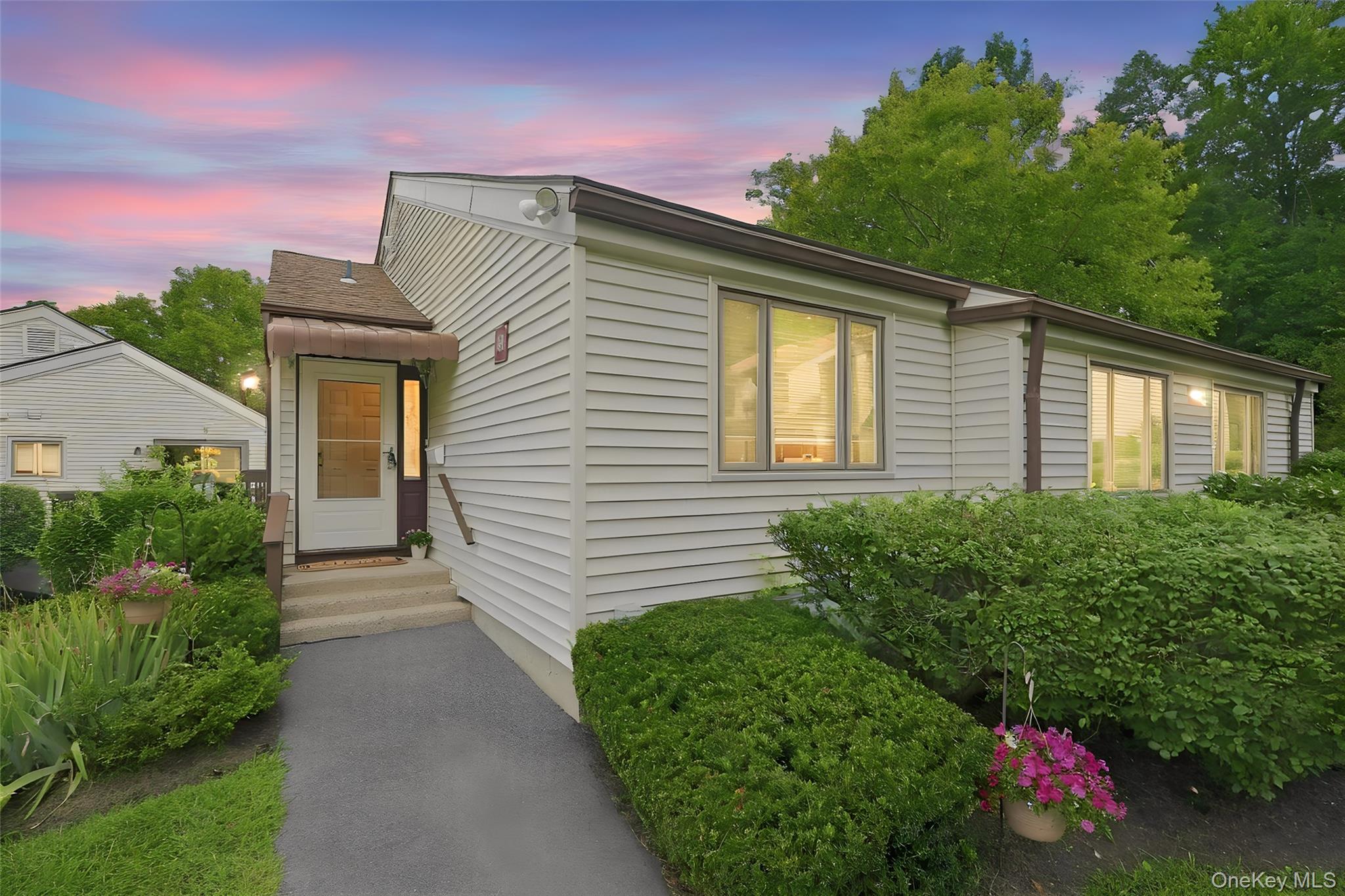 Welcome to effortless, one-level living in the highly sought-after 55+...
