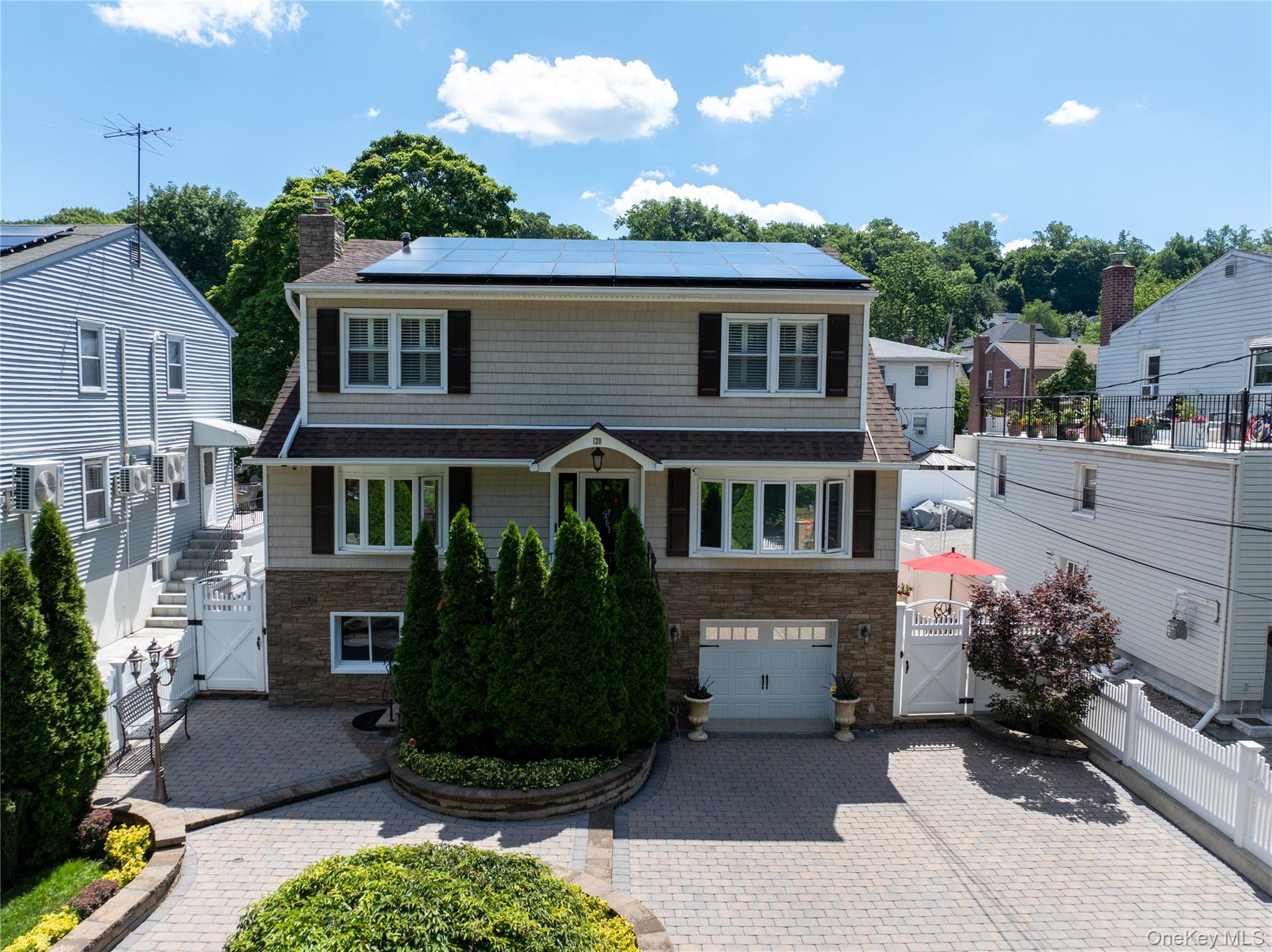 Welcome to 120 Harrison Avenue, a meticulously maintained legal 2-fami...