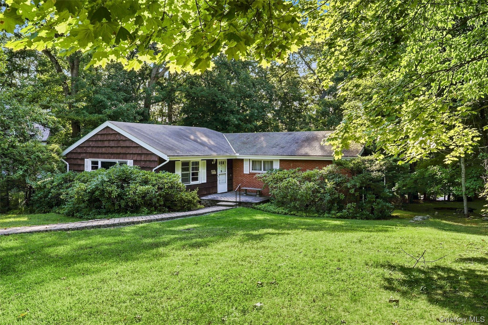 Opportunity awaits at 7 Overhill Road, a spacious 3-bedroom, 2-bath Ra...