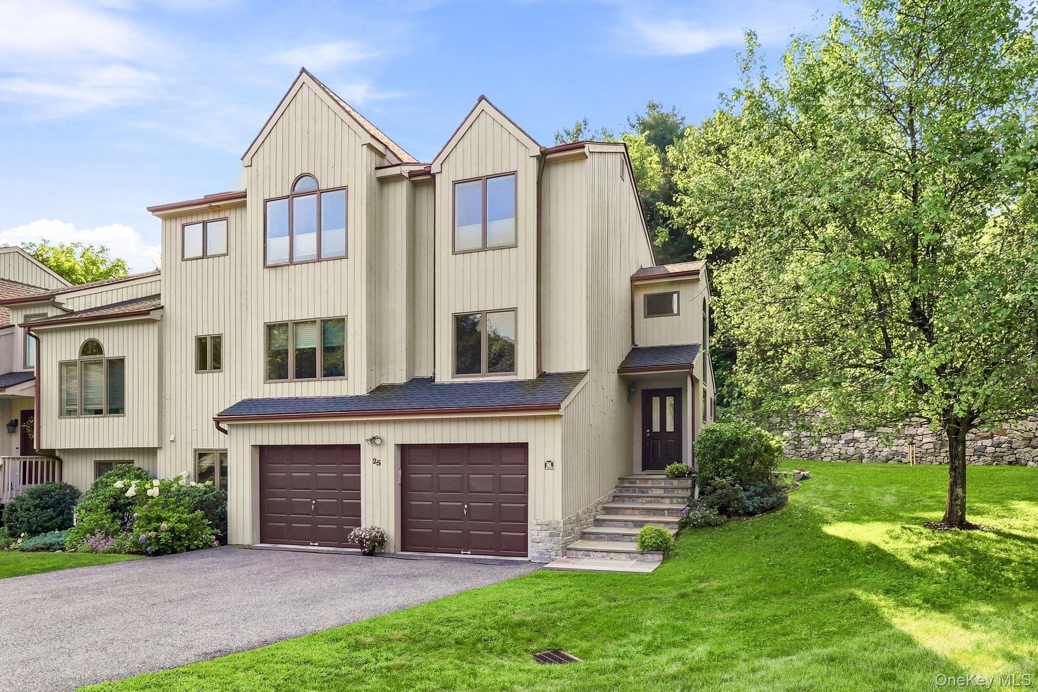Tucked inside a quiet Greenbriar cul-de-sac, this end-unit home at 25...