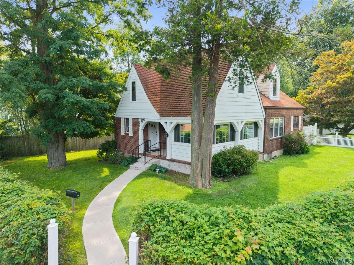 Nestled in the desirable Poet’s Corner neighborhood and set well back...