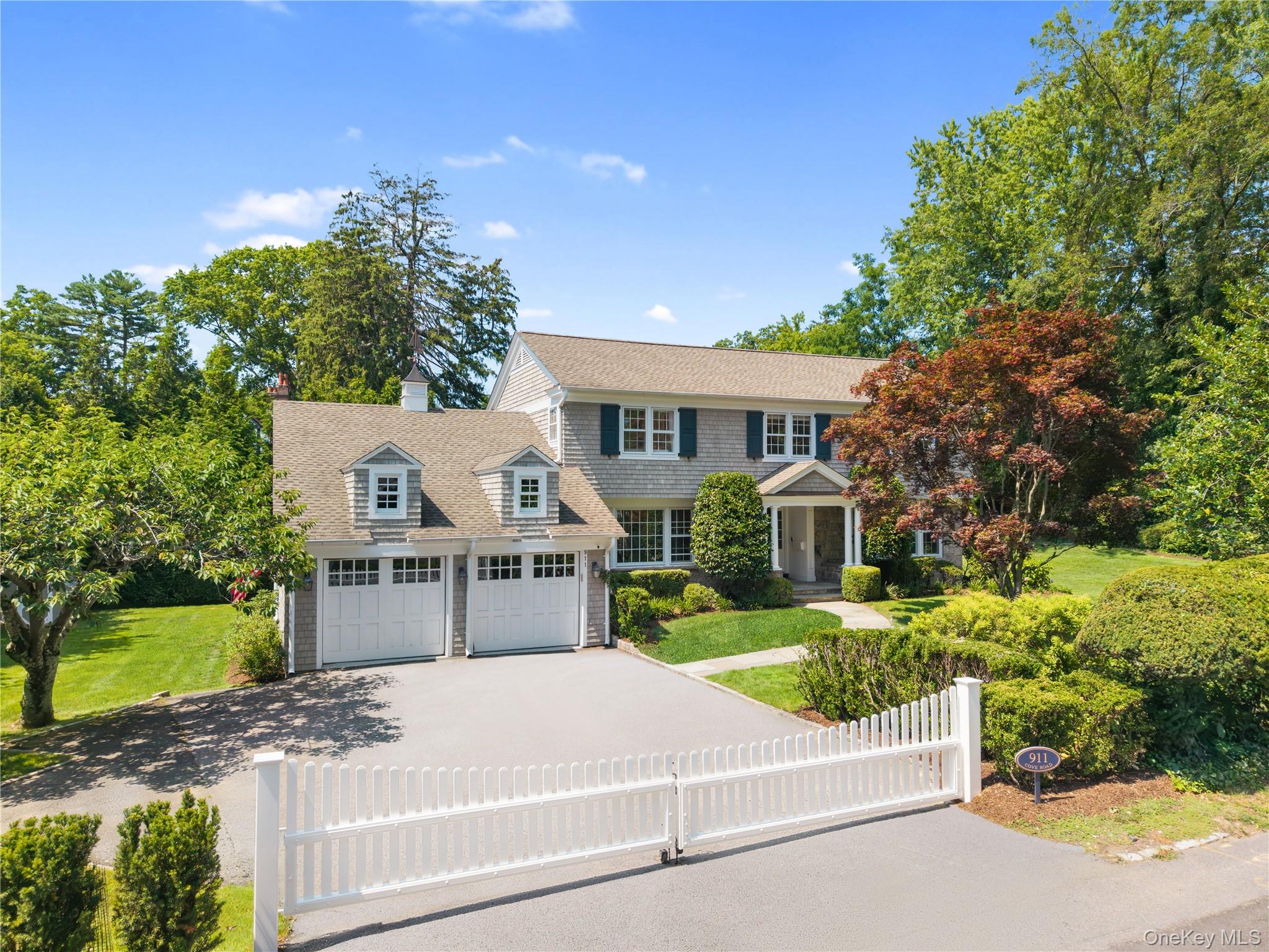 Welcome to 911 Cove Road, a charming center hall Colonial nestled in t...