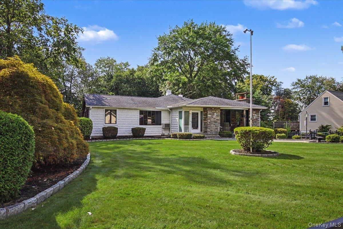Definitely not your cookie-cutter ranch!  This distinctive three-bedro...