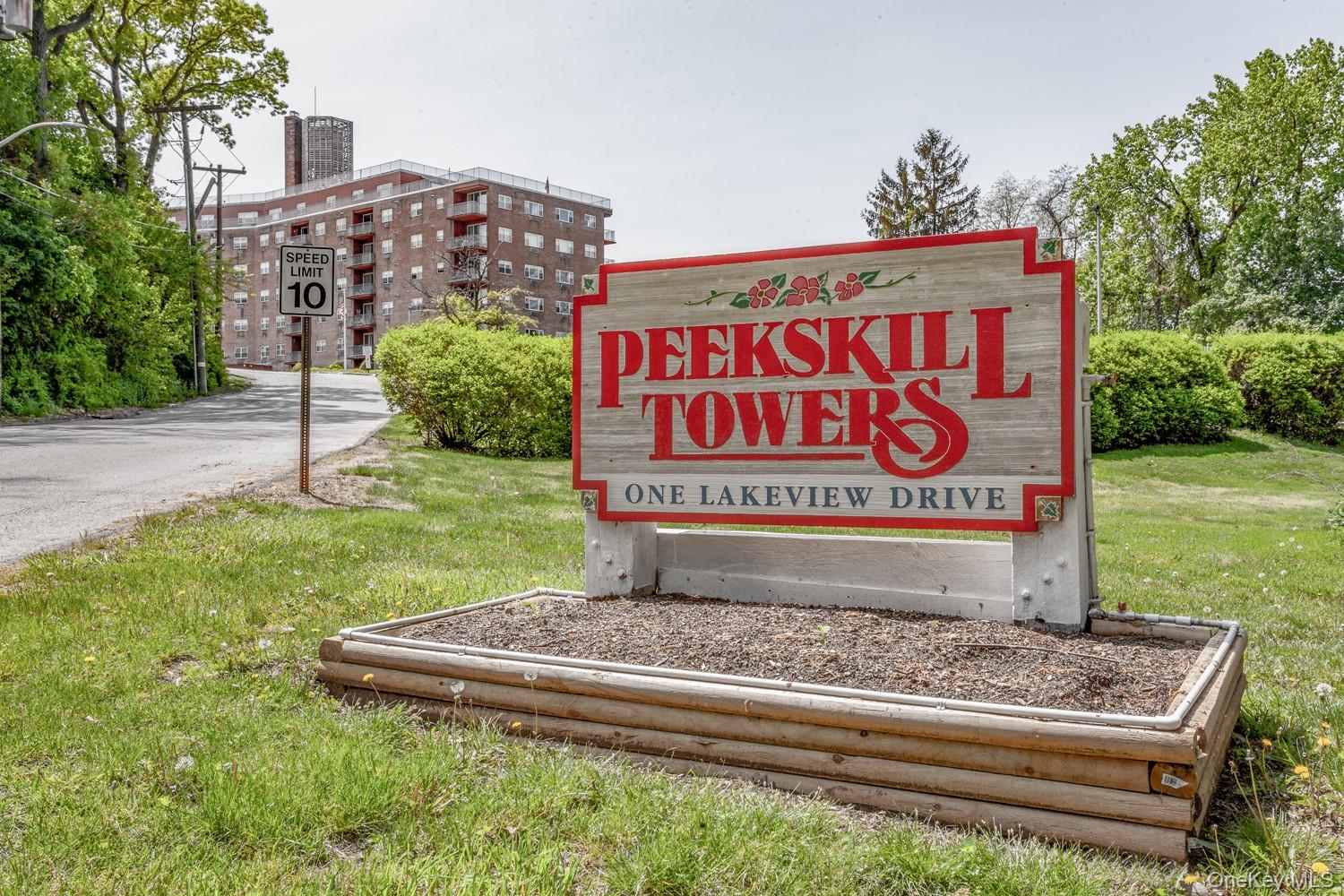 Rarely available ground-floor living at 1 Lakeview Drive! This spaciou...