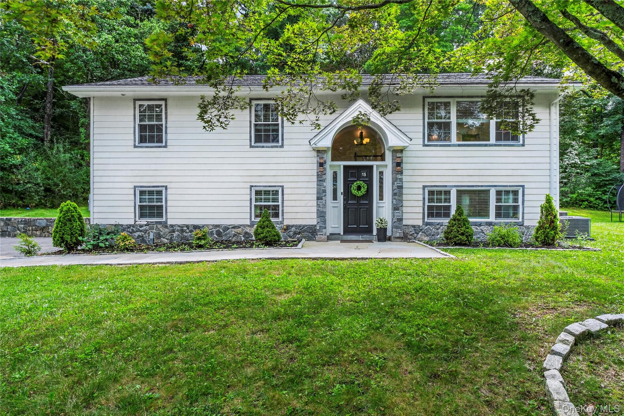 Welcome to this beautifully renovated Open-Concept Raised Ranch on .65...