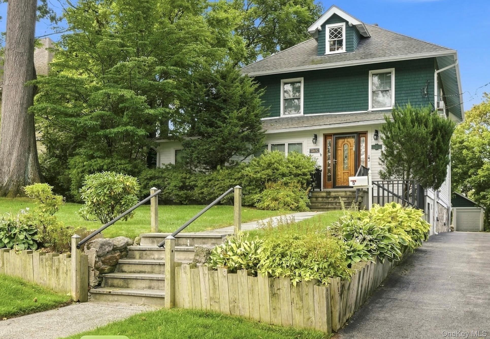Welcome to 5 Woodland Place, a captivating 1924 Colonial set on beauti...