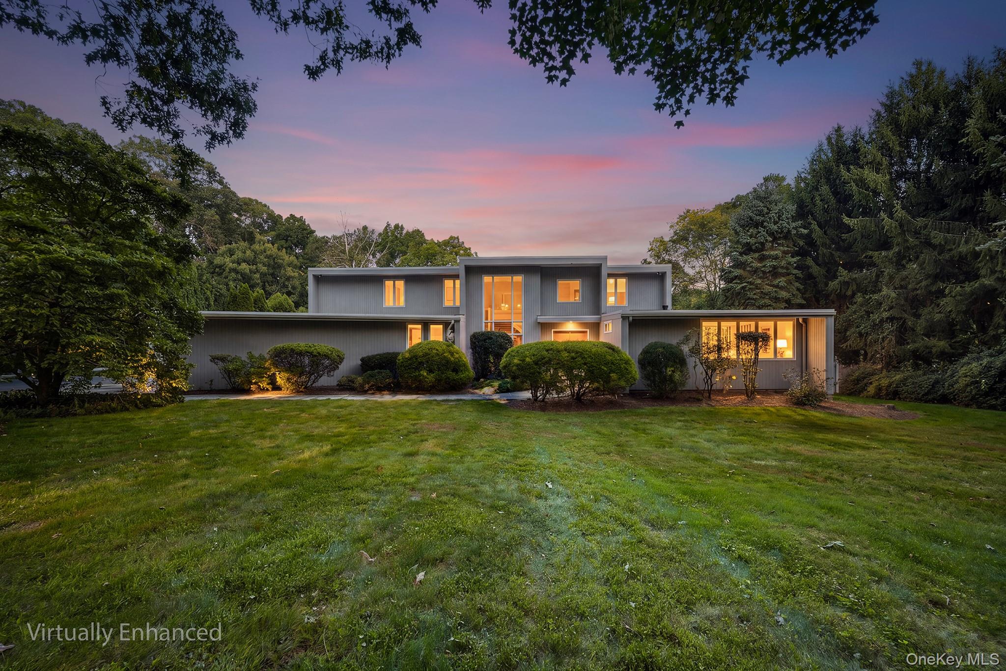 Privately set on over an acre overlooking picturesque Pocantico Lake,...