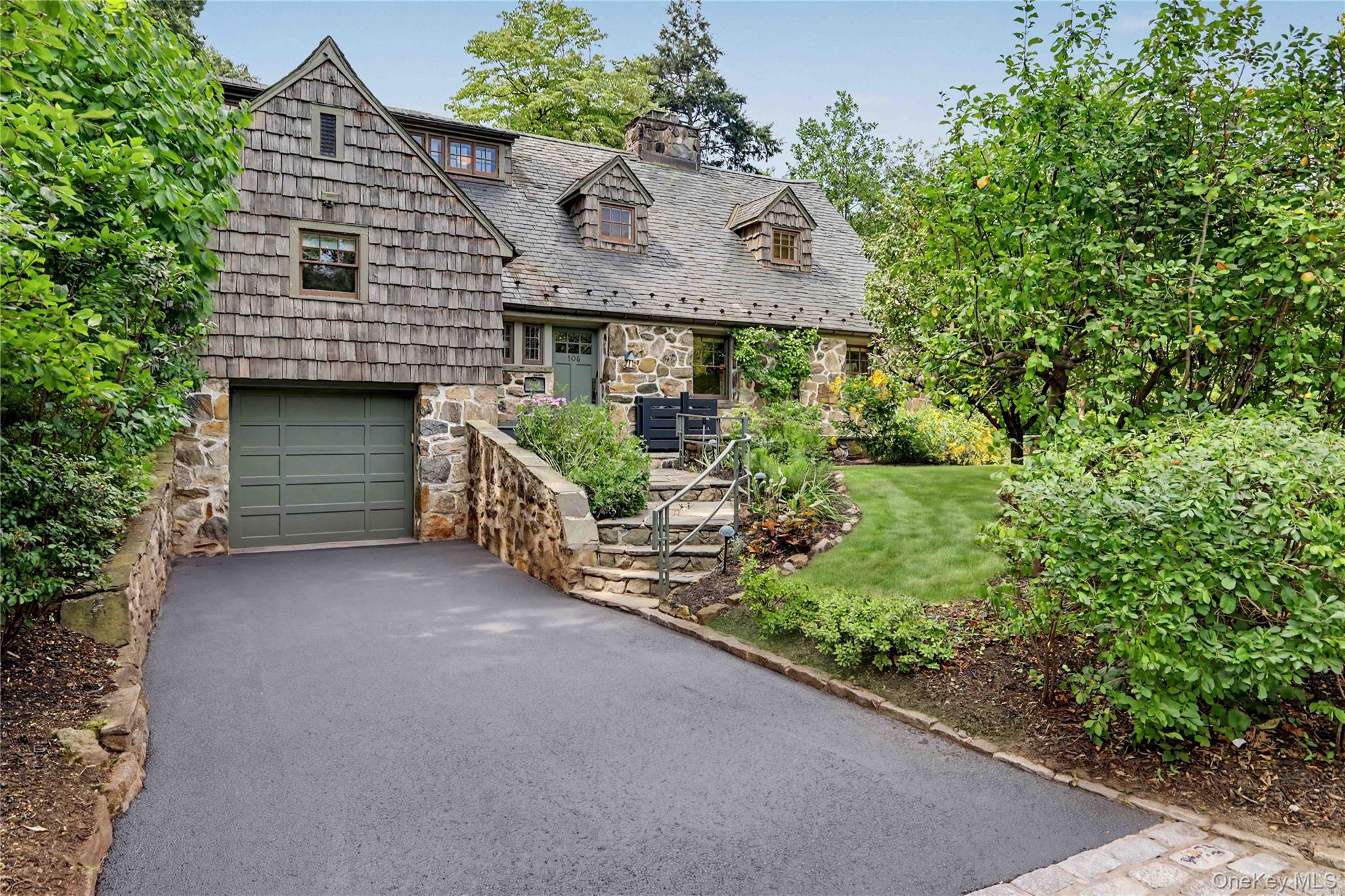 Overlooking 15 acres of Glenwood Lake, this 1928 five bedroom Arts & C...