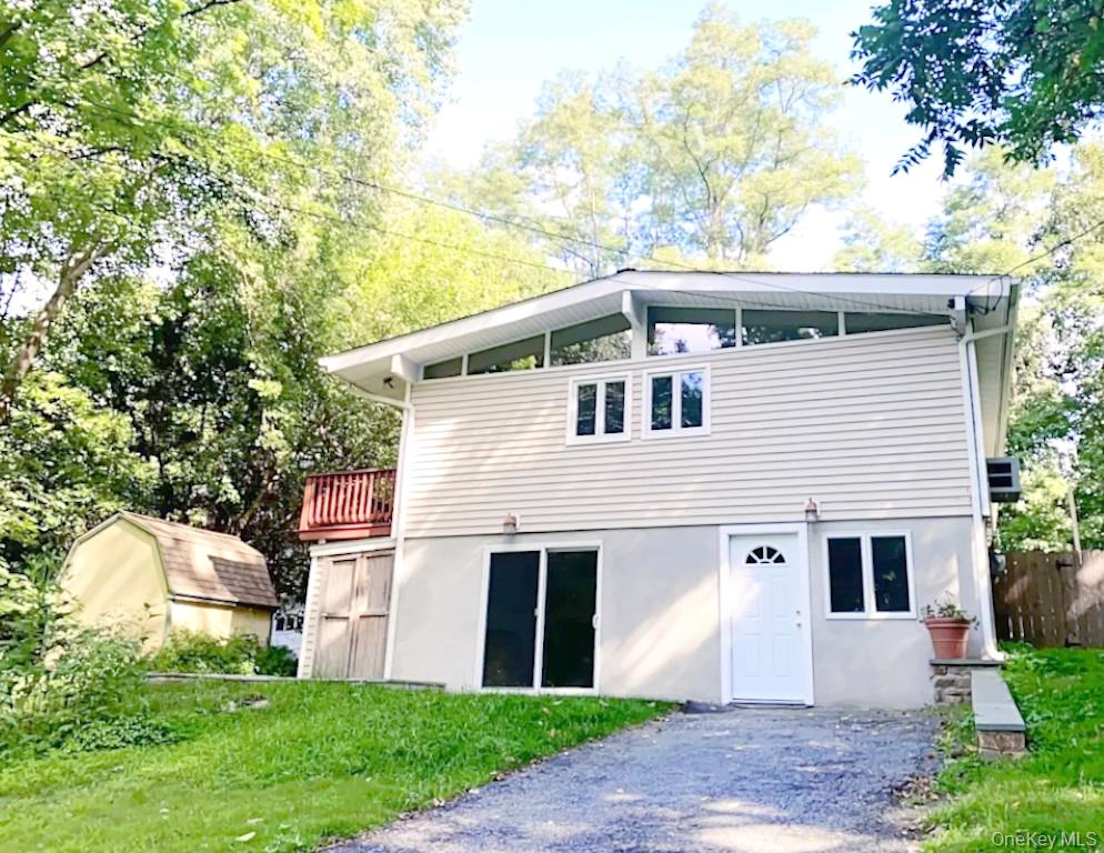 Welcome to this recently renovated lower-level apartment in the heart...