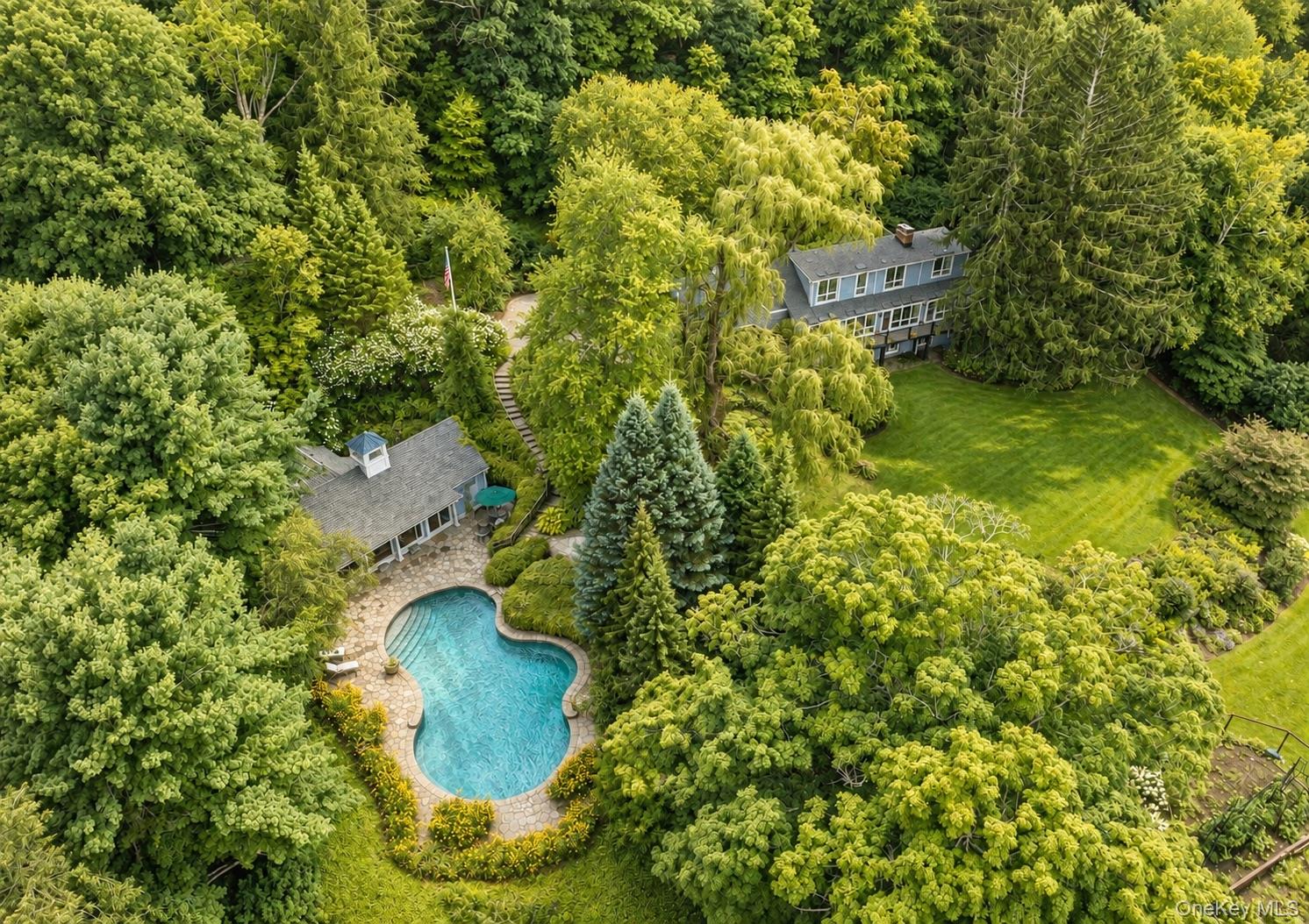 Captivating North Salem Retreat. Enveloped by rolling emerald lawns, v...