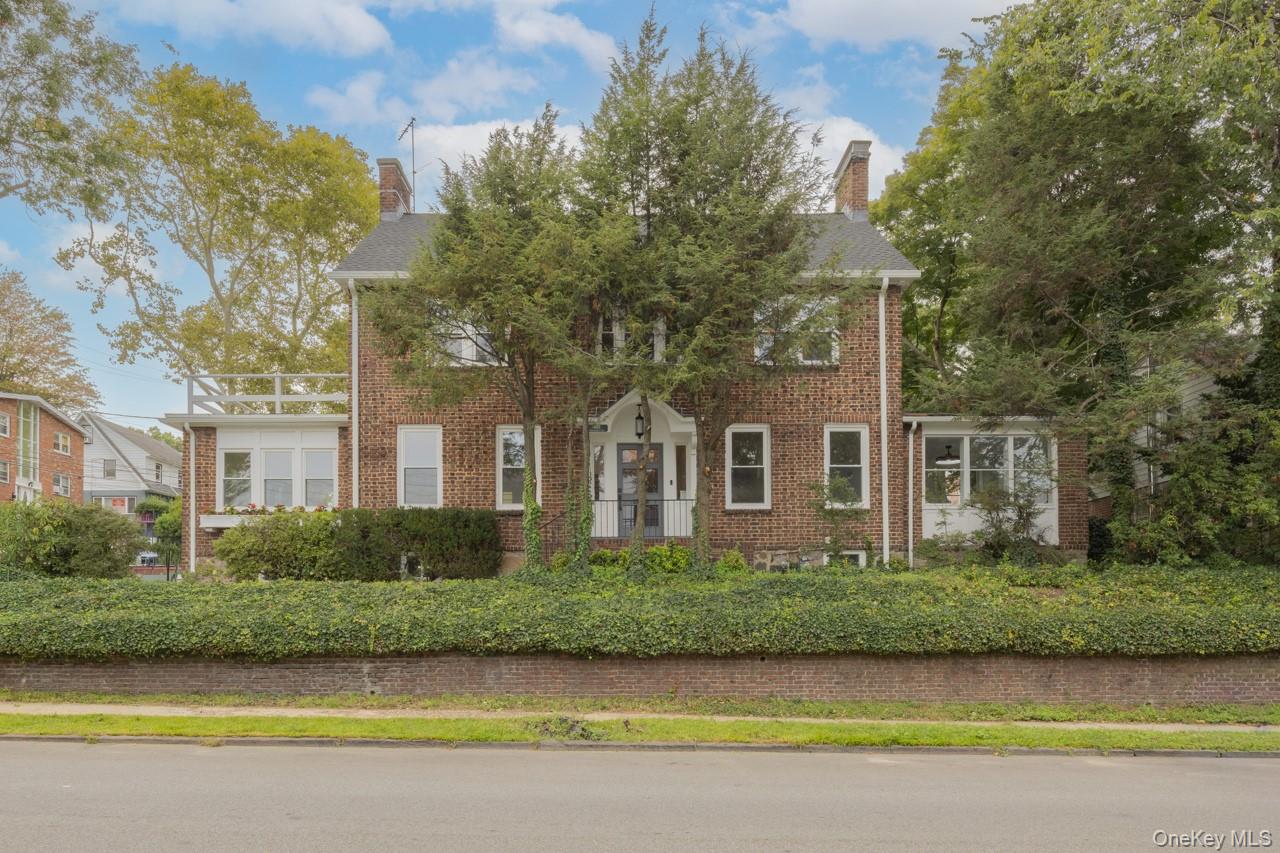 A sleek and reimagined classic luxury brick colonial home in convenien...