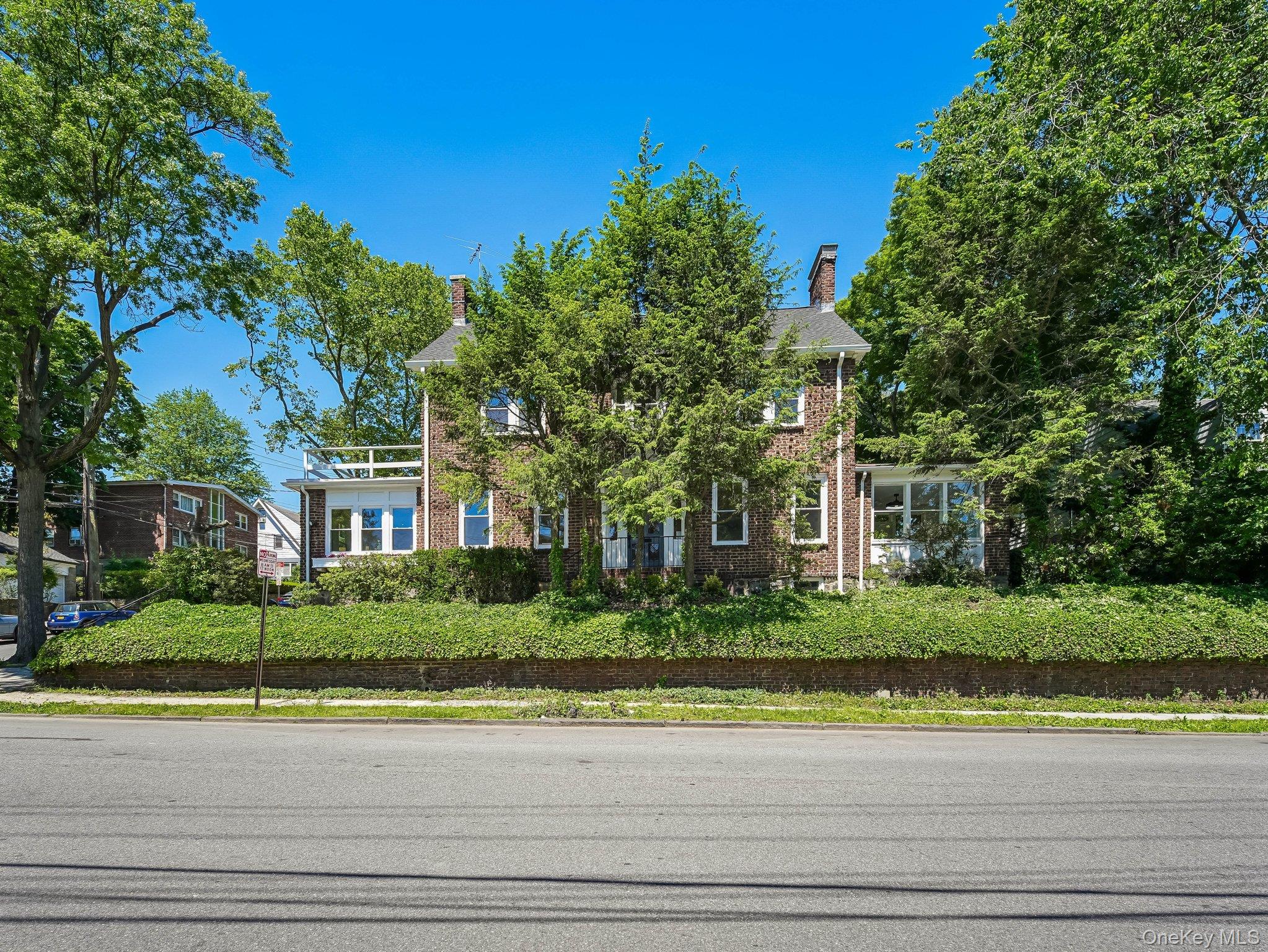 A sleek and reimagined classic luxury brick colonial home in convenien...