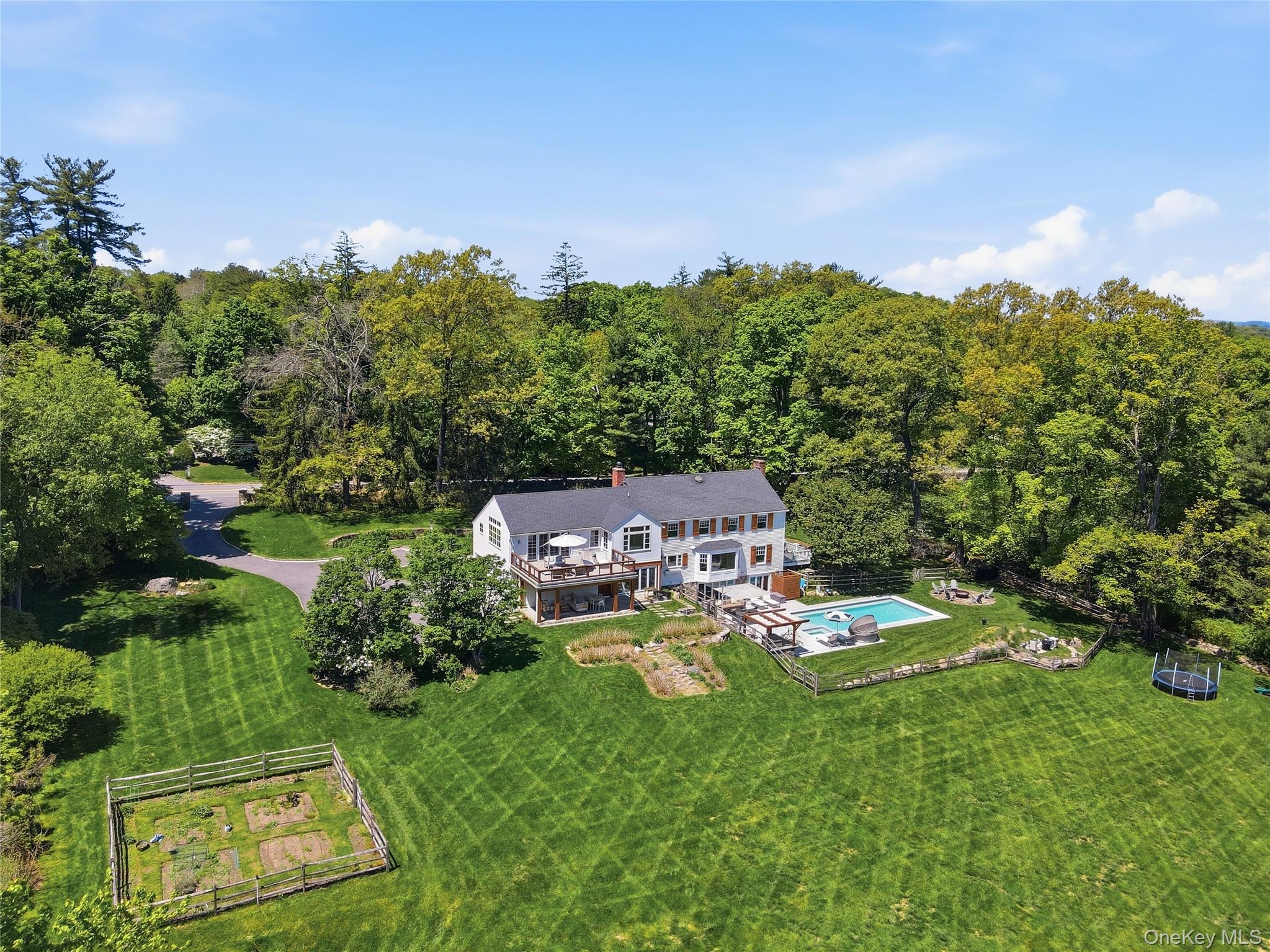Welcome to this fresh, modern, fully gut-renovated five-bedroom Coloni...