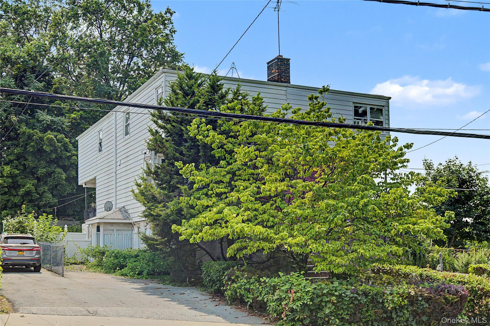 Welcome to 58 Palmer Road in Yonkers, a classic semi-attached two-fami...