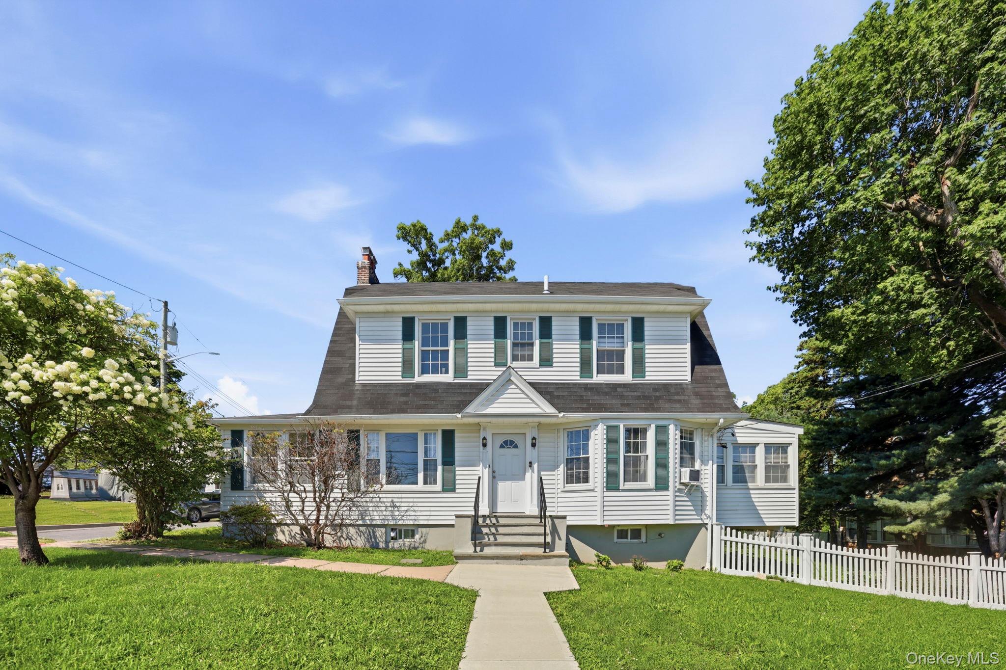 Welcome to 54 Hartsdale Road, where classic charm meets a crisp, moder...