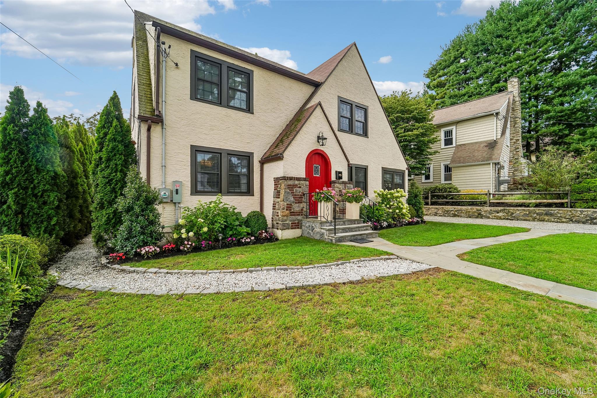 Welcome to 7 Parkview Court, a classic Tudor offering timeless archite...