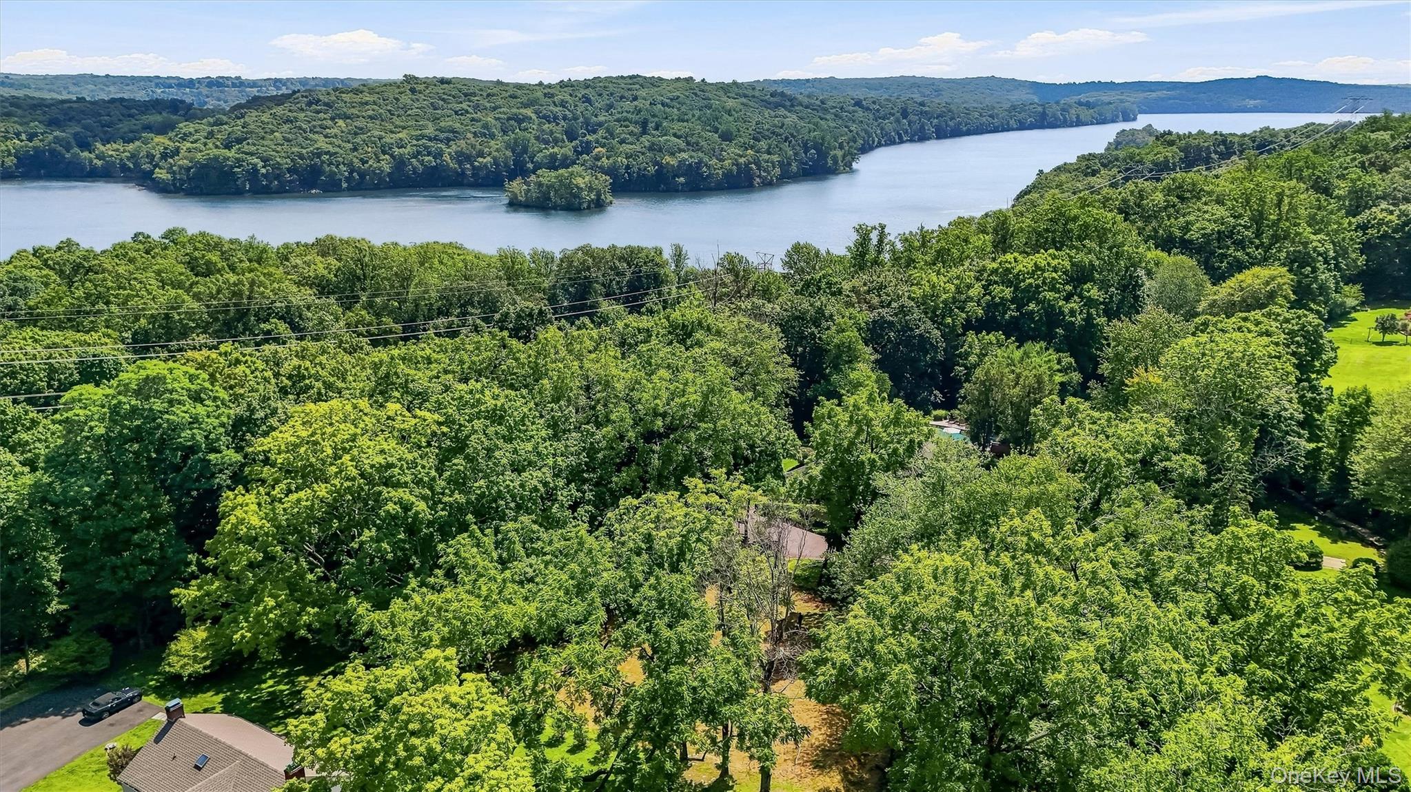 Rare 1-Acre Building Lot with Reservoir Views in Mount Pleasant. An op...
