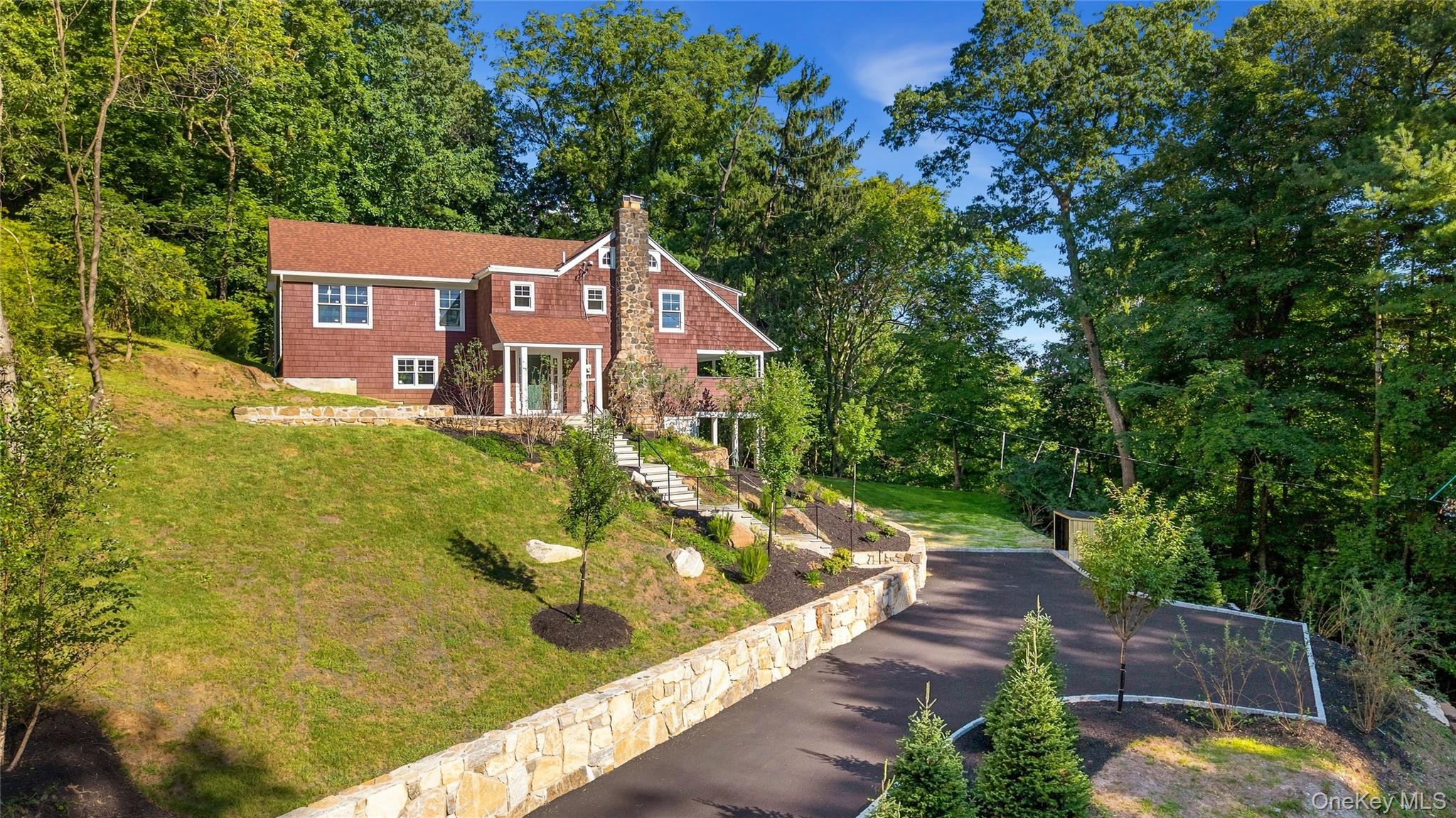 An exquisitely renovated residence set on a private, wooded lot in one...