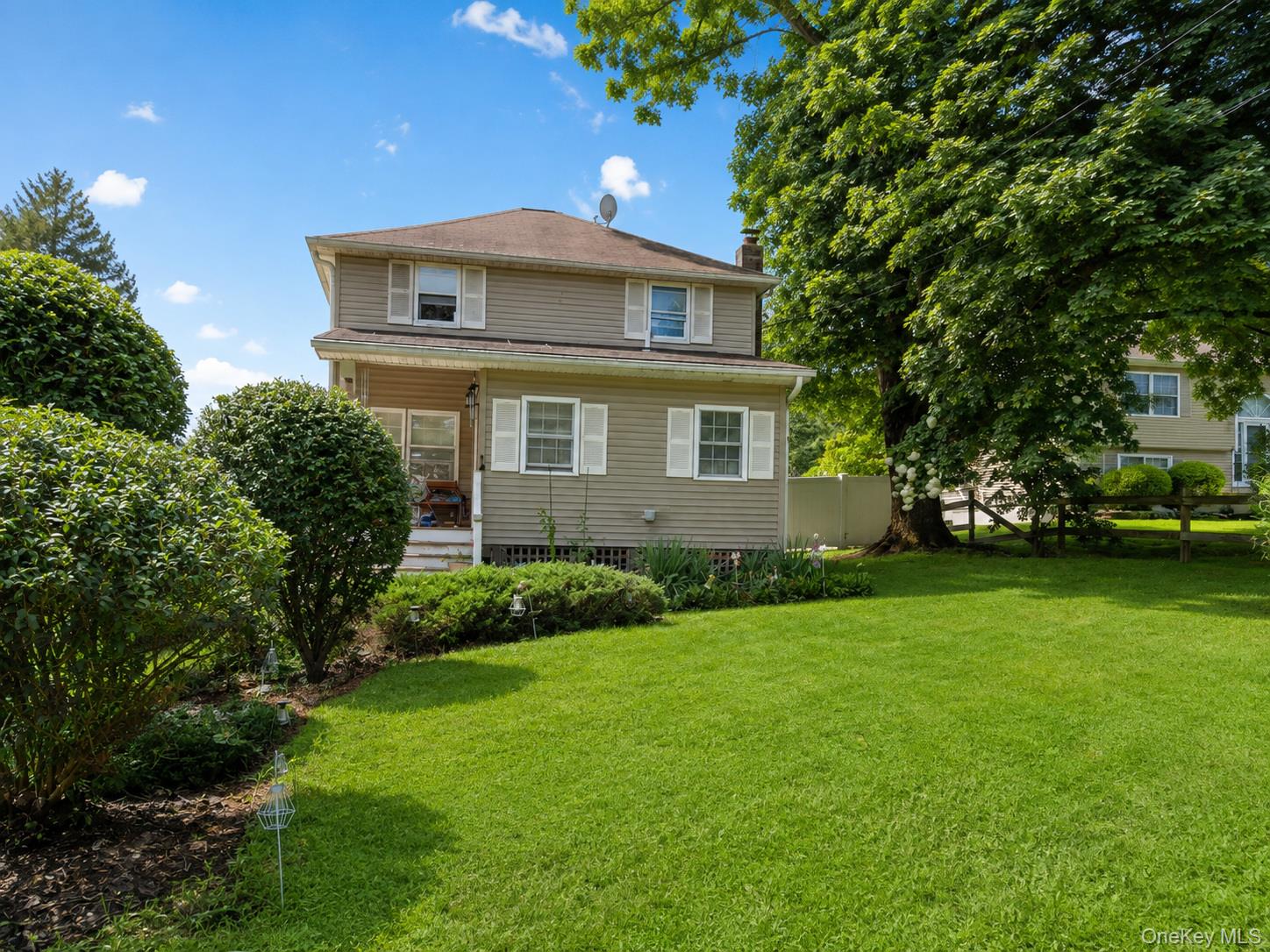 Welcome to this warm and inviting Colonial-style home, offering charmi...