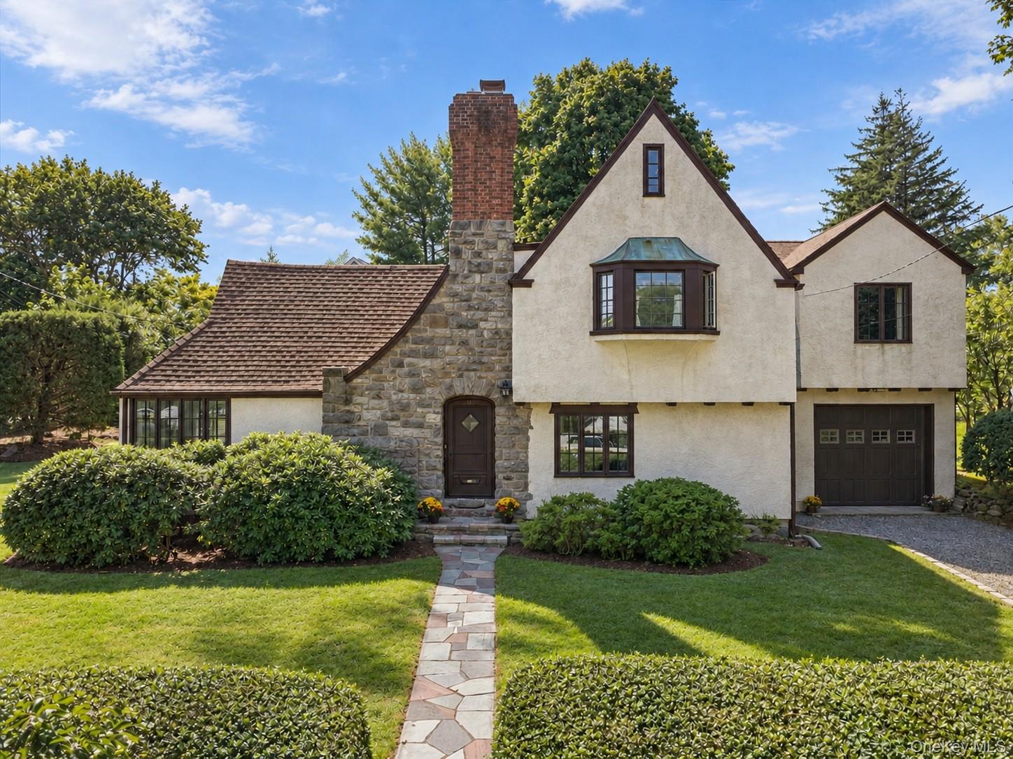 Classic Tudor charm meets an easy, flexible layout in this character-f...