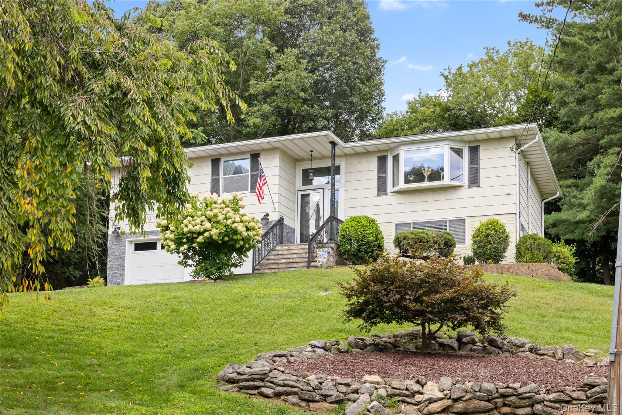 Set back from the road and perched high on the hill, this move-in-read...