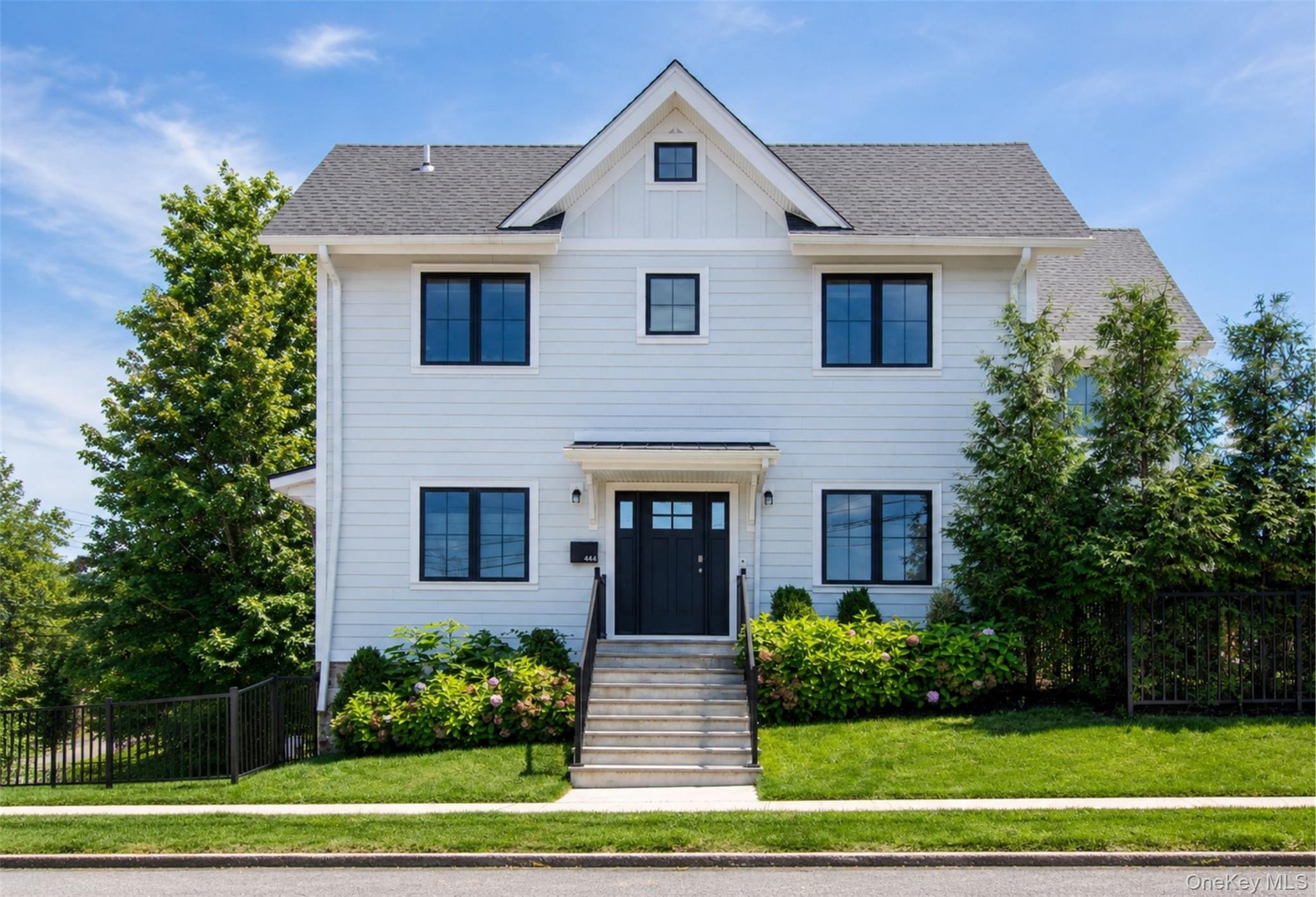 Welcome to this exceptional **4-bedroom modern farmhouse in Pelham, NY...