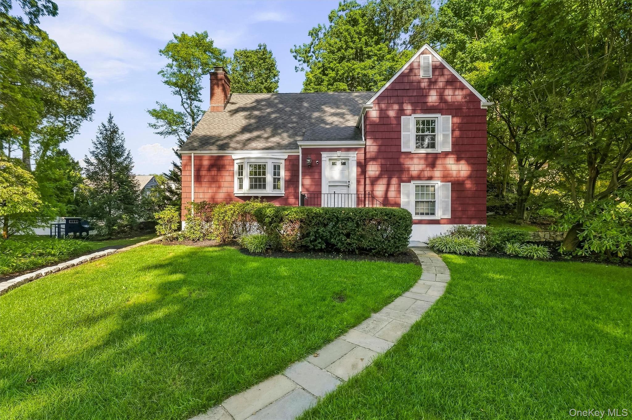 Nestled in a park-like setting on an oversized lot in the tranquil, lu...