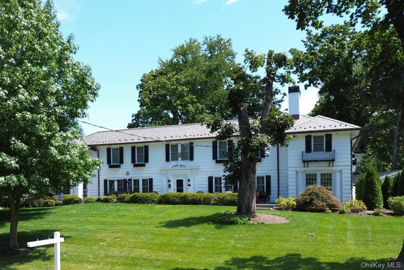 Timeless Colonial elegance meets modern luxury in this exceptional wes...