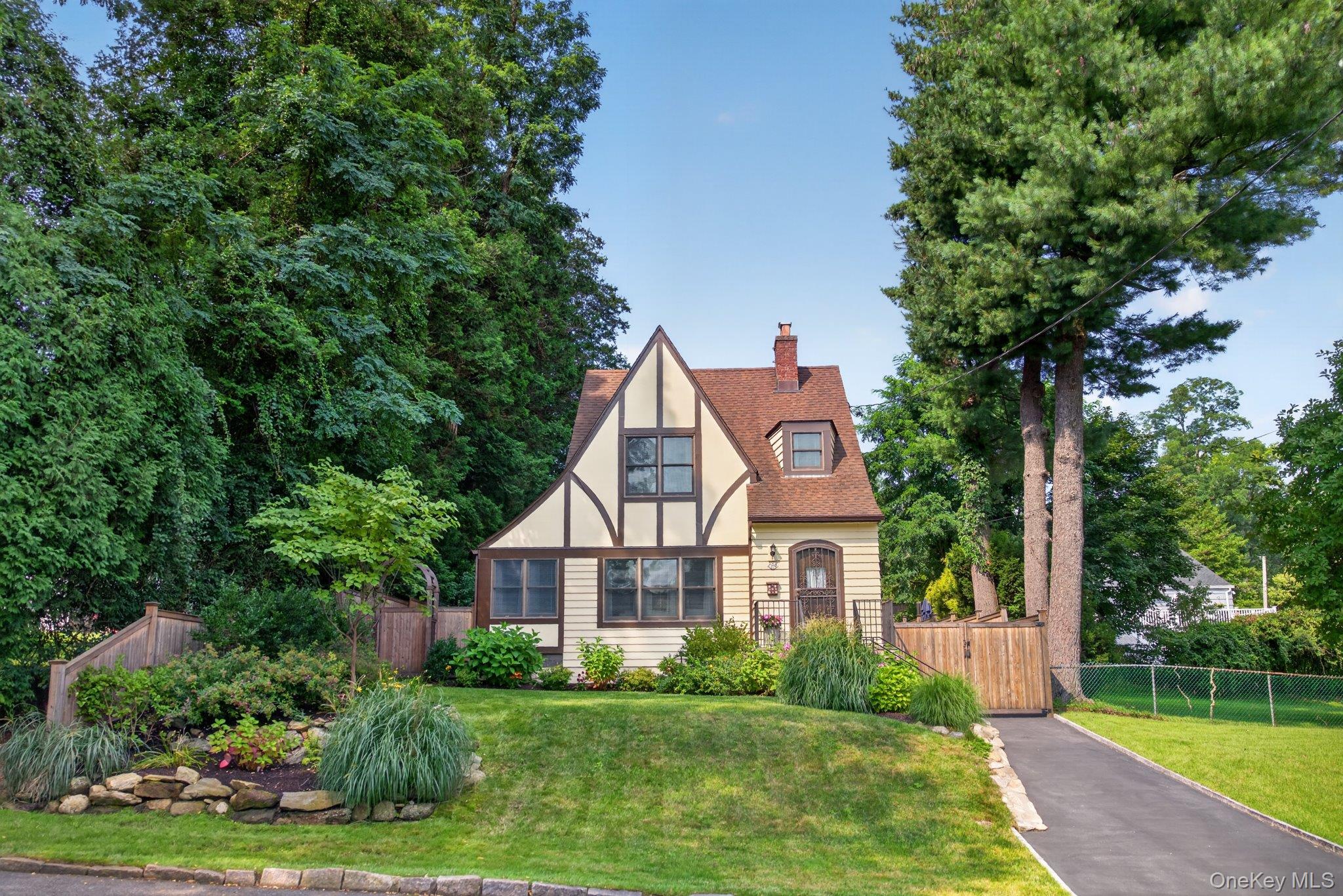 Tudor-style home situated in the highly desirable Poet’s Corner neighb...