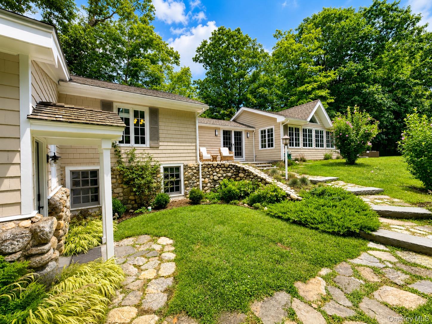 9 Lewis Road is the most charming country compound in Pound Ridge. Tuc...
