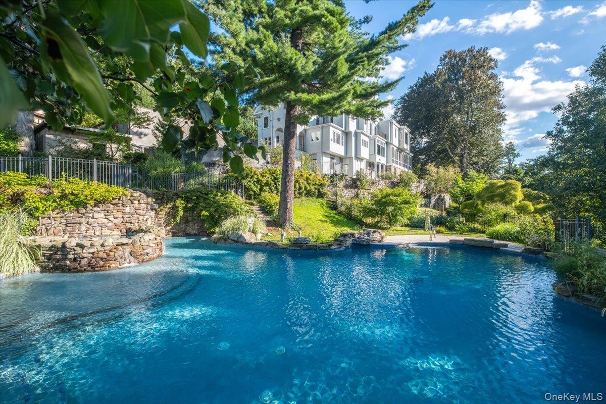 Gracing an impressive 4.28 acres overlooking the Hudson River, this ex...