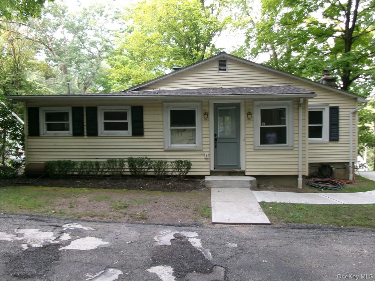 Nestled in the midst of an idyllic, tree-filled, half-acre setting, th...