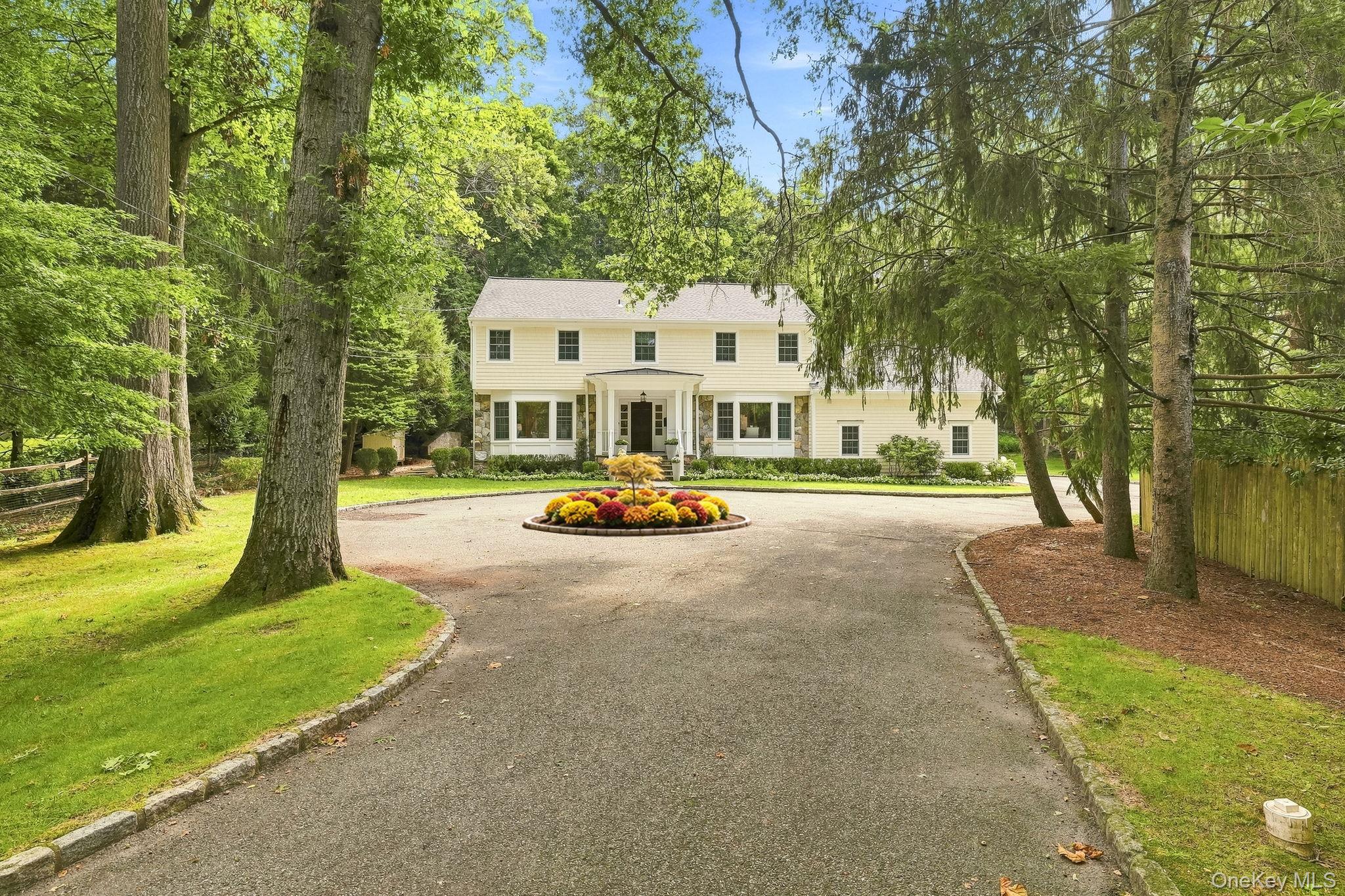 Set well back from the road on 1 private acre, this home offers a sens...