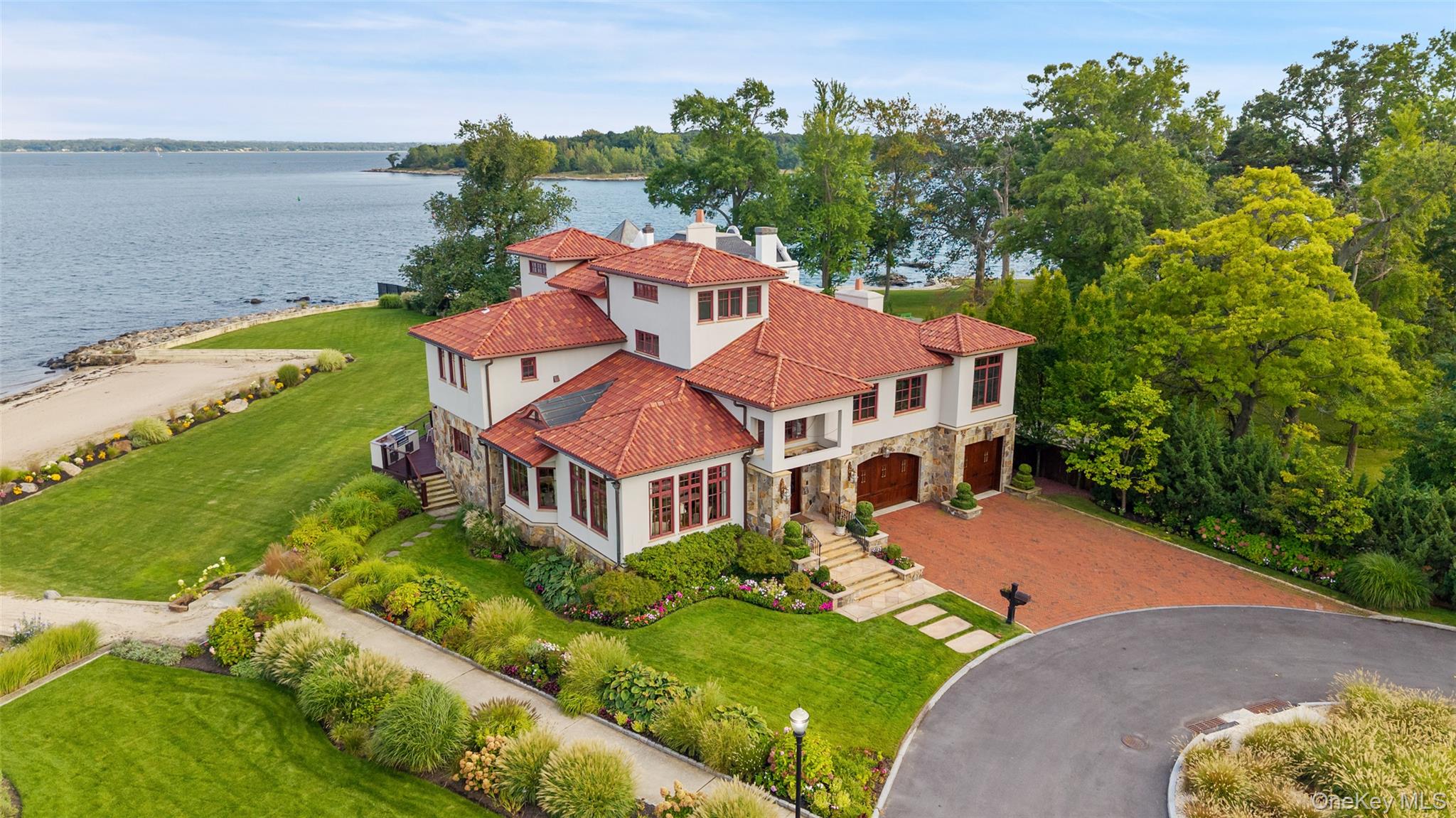 Set within an exclusive gated community along the LI Sound, this extra...