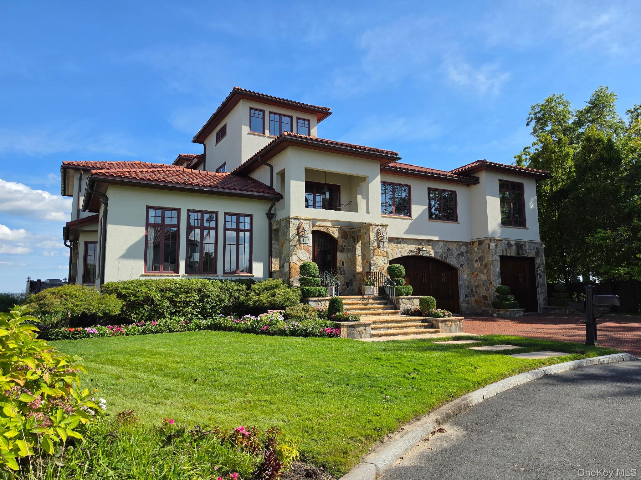Set within an exclusive gated community along the LI Sound, this extra...